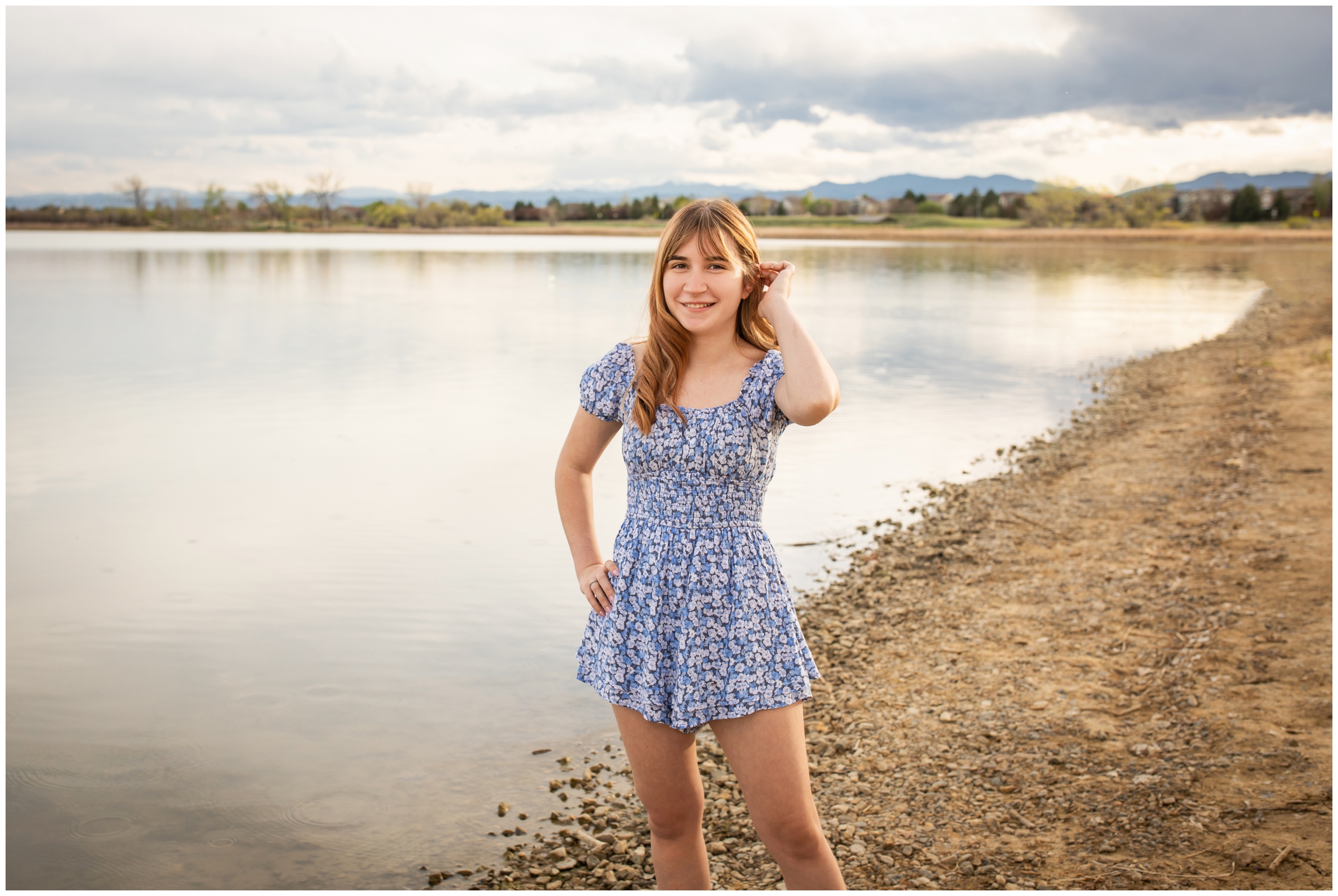 teen posing in front of mountain lake during northern Colorado senior pictures by Plum Pretty Photography 