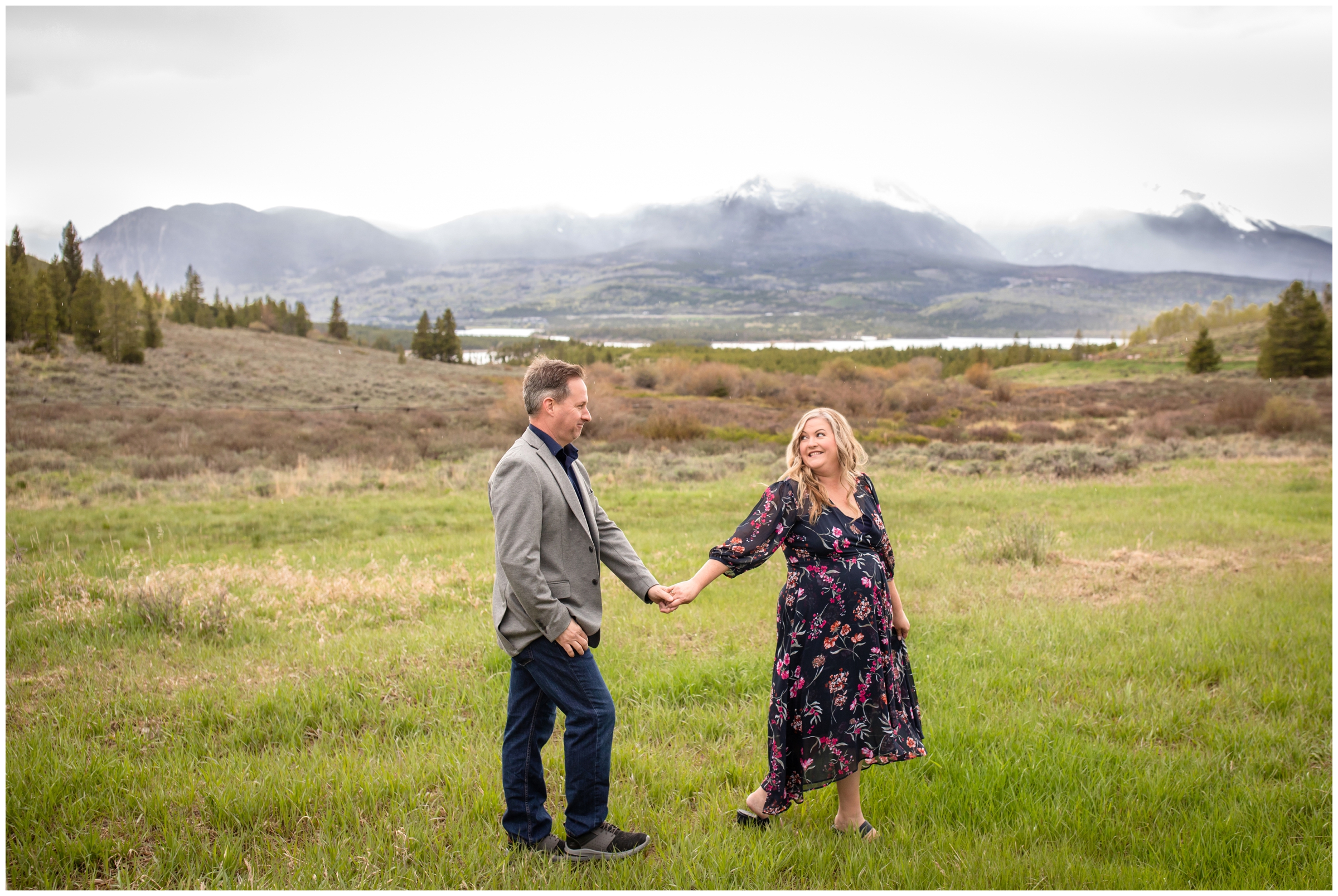 bride and groom walking through a field during Breckenridge elopement pictures at Windy Point Campground by Colorado wedding photographer Plum Pretty Photography
