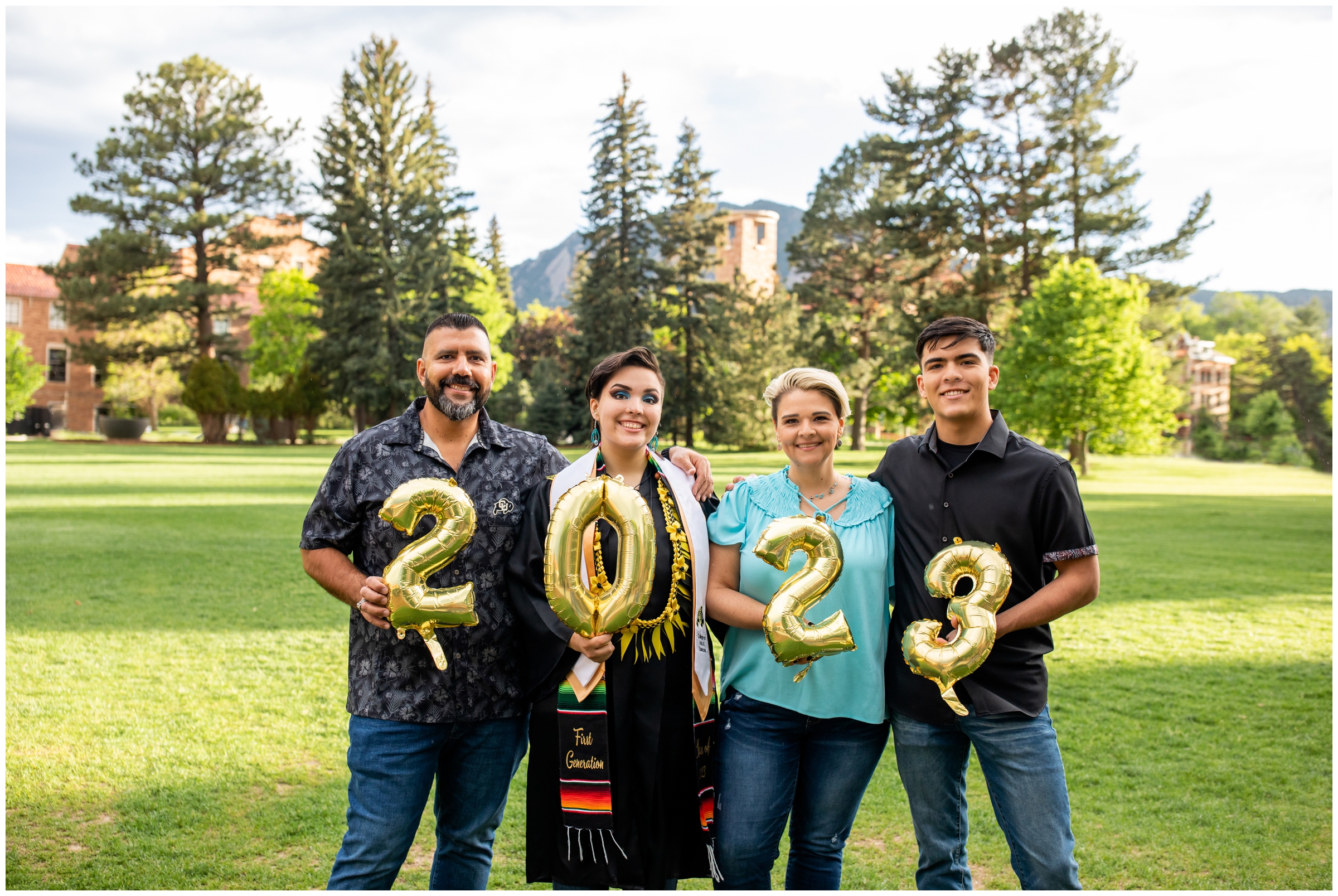 family holding graduation balloons during CU Boulder college senior portraits