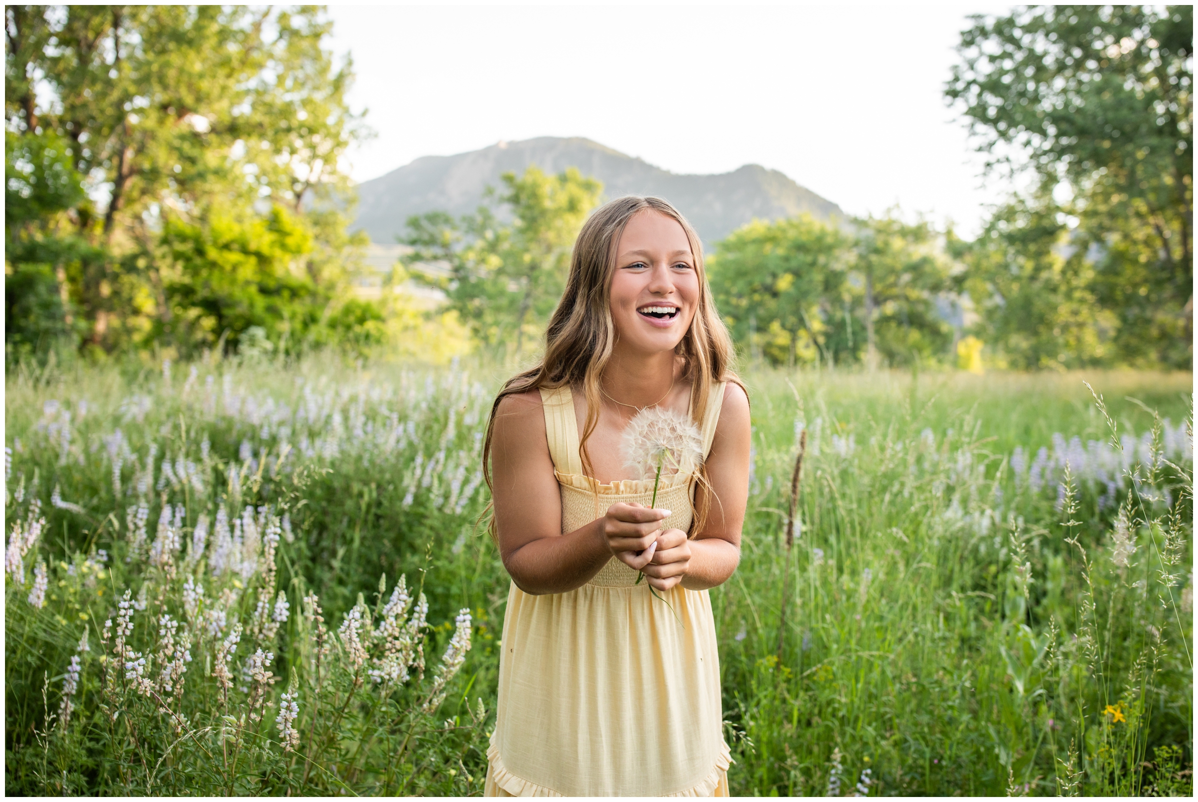 teen laughing during candid senior pictures in Boulder Colorado