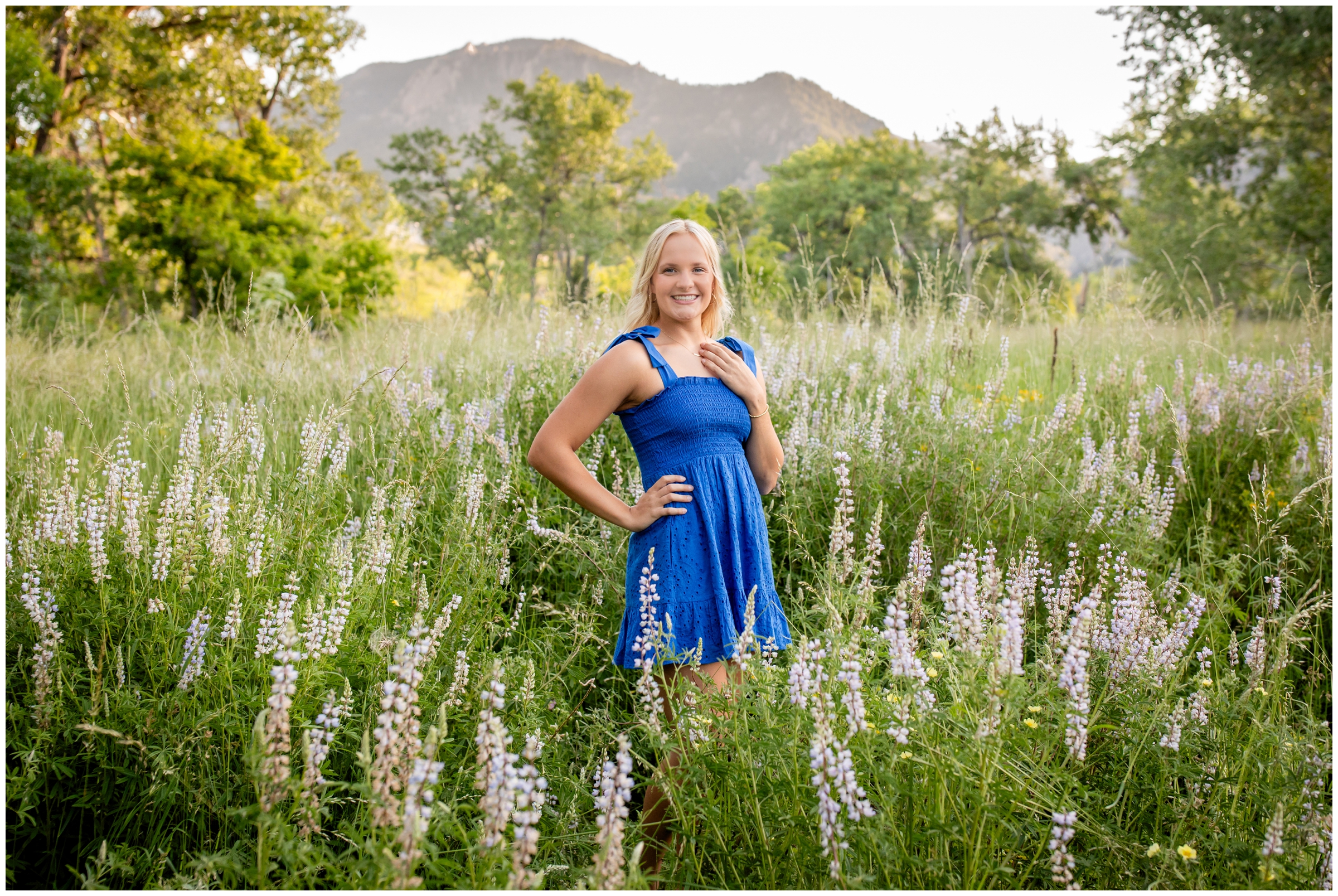 teen posing in a mountain flower field during Colorado senior portraits at South mesa