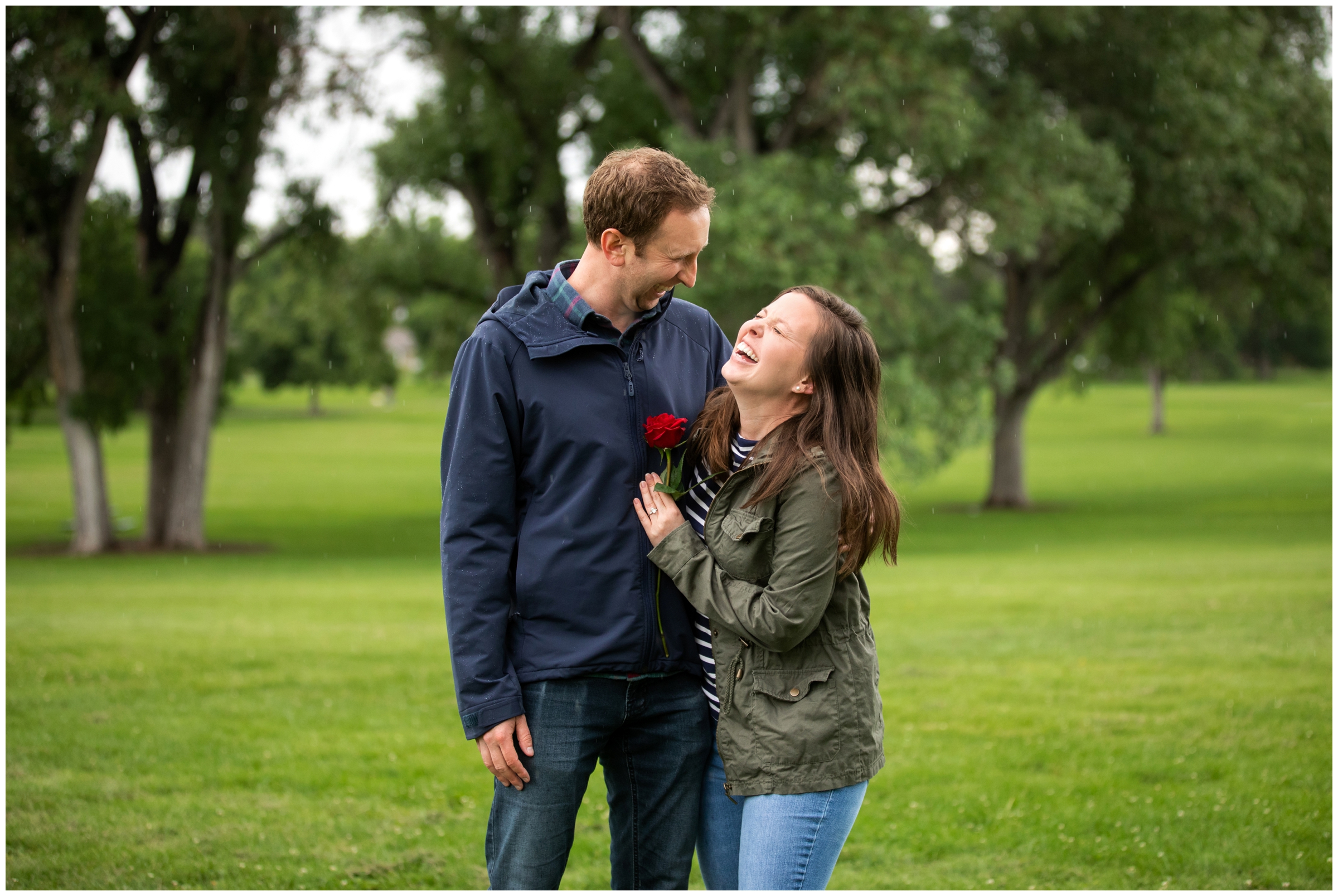 woman laughing after surprise proposal in a Denver park