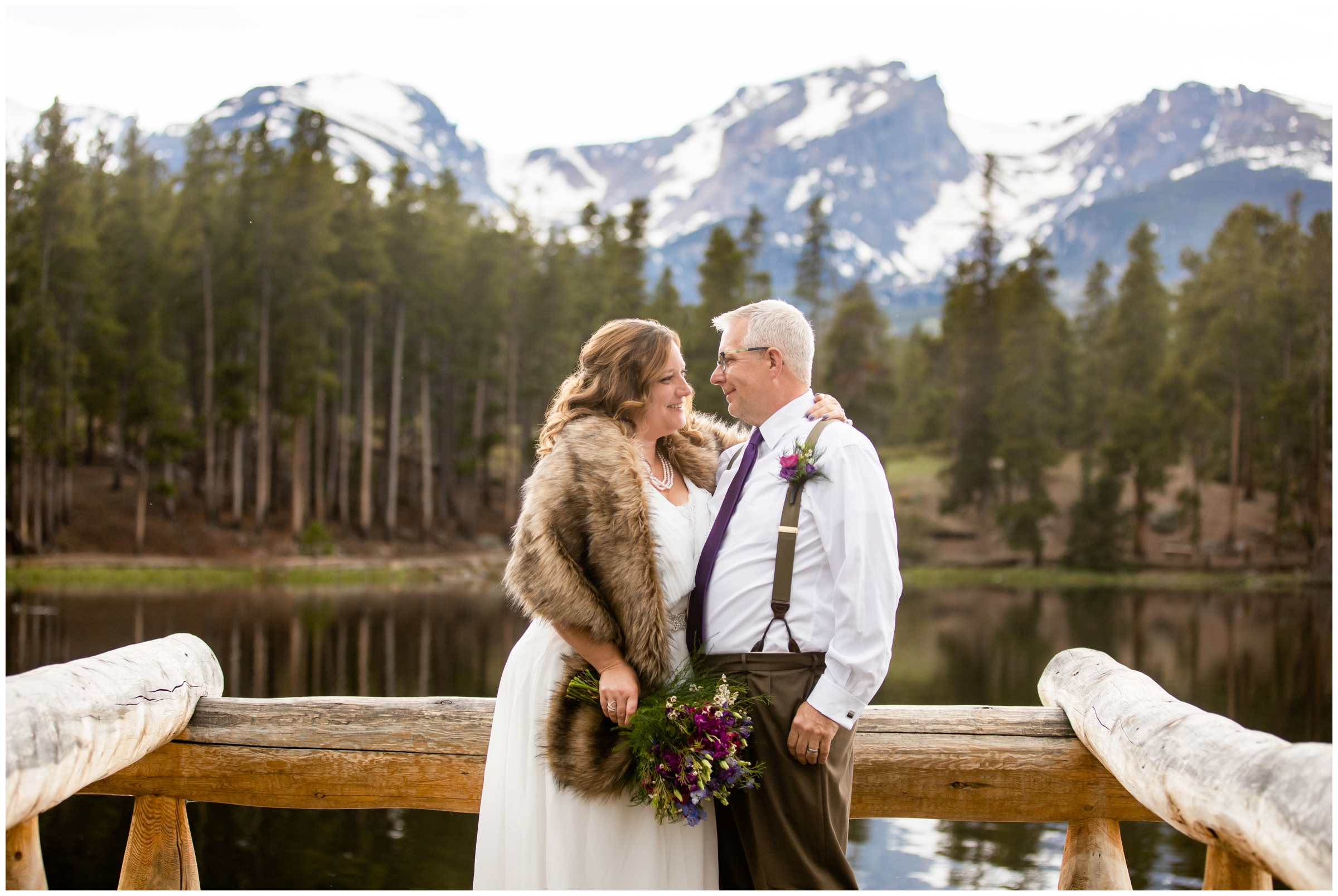 couple posing on wooden dock at Sprague Lake during RMNP spring elopement wedding pictures by Plum Pretty Photography 
