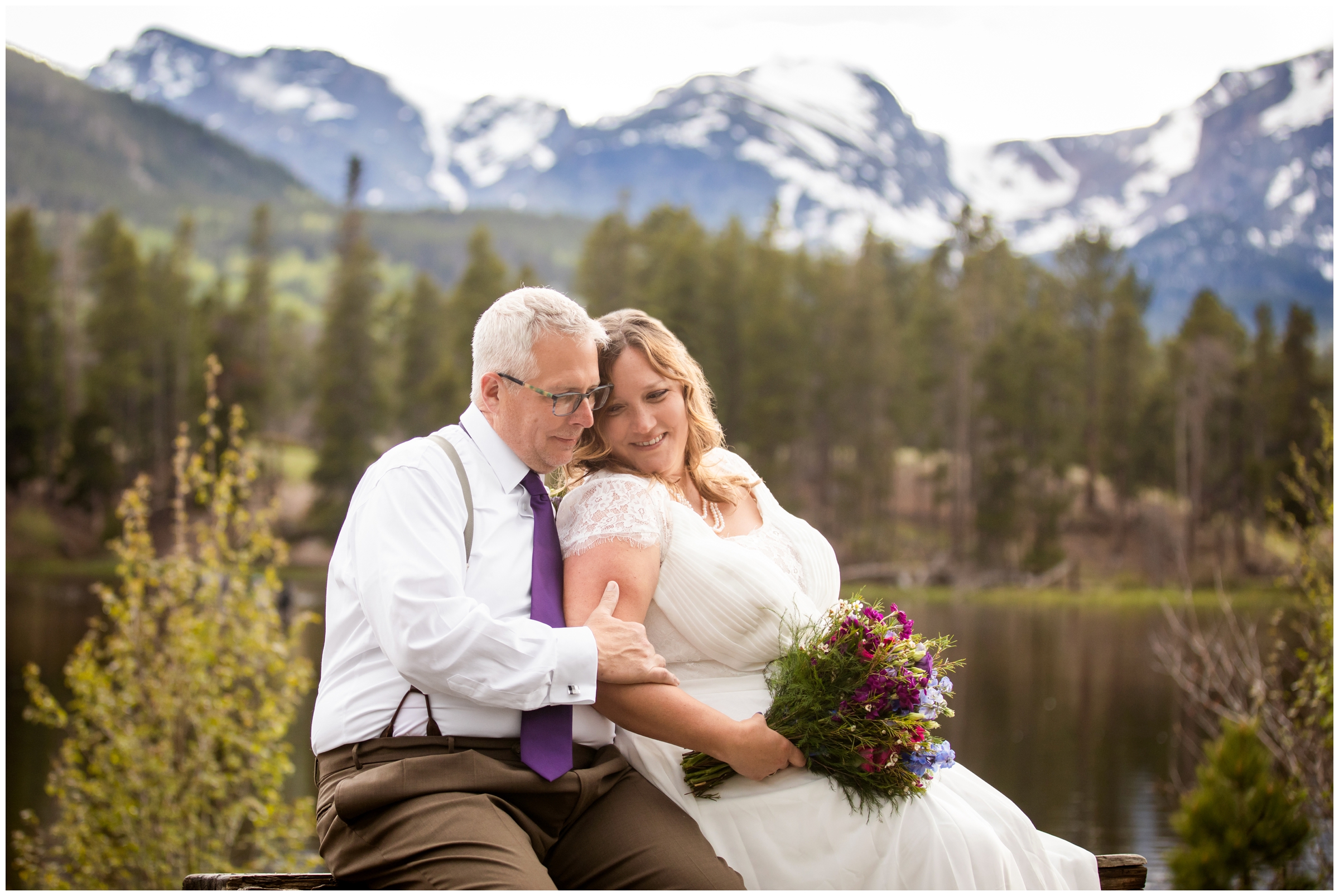 couple cuddling on a bench during Colorado mountain wedding pictures at Sprague Lake