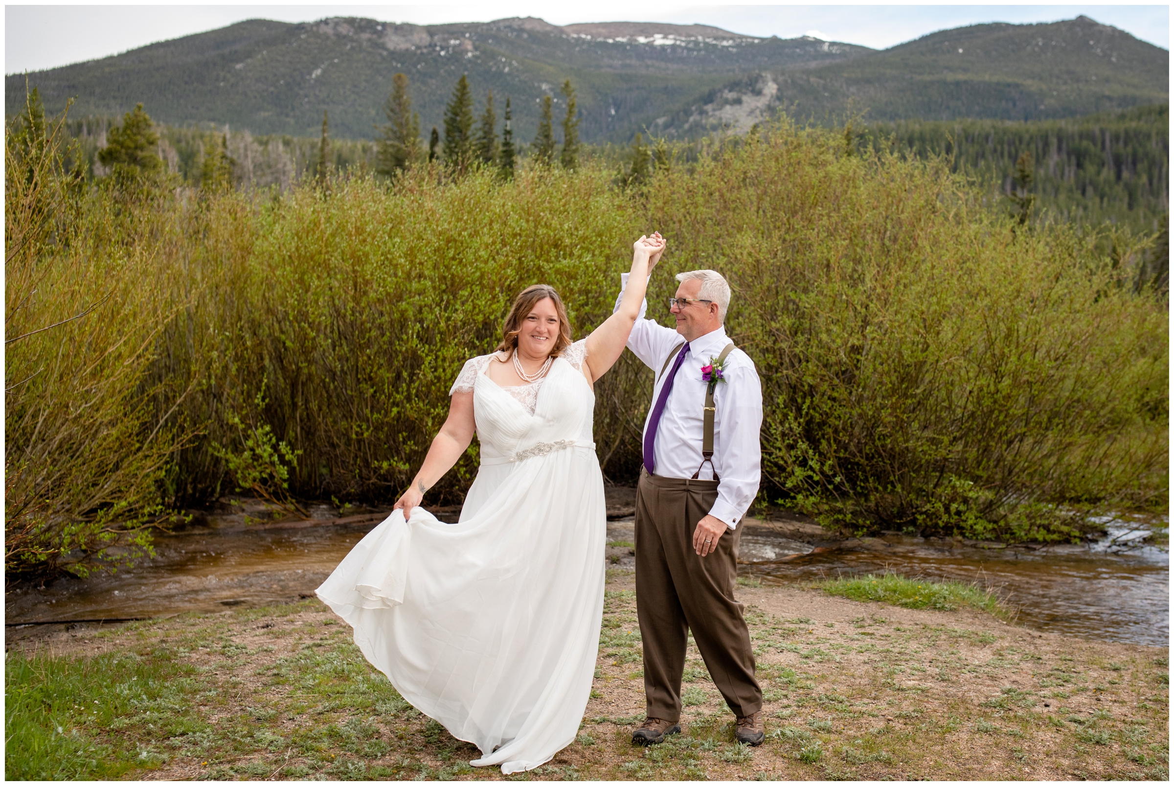 couple dancing with mountains in background during RMNP elopement wedding photos 