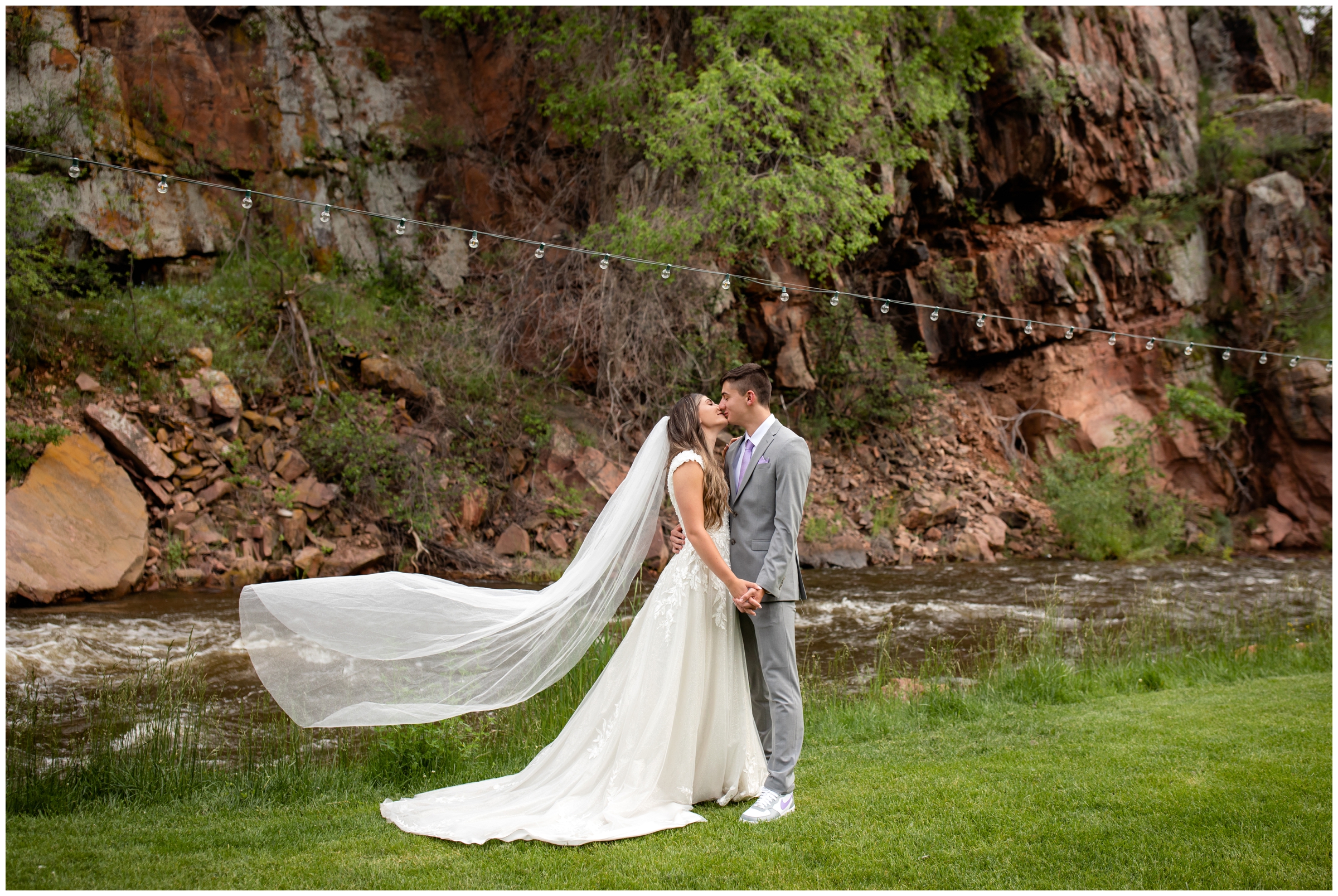 bride's long veil flowing in the wind during Colorado elopement wedding pictures at the Lyons Farmette 