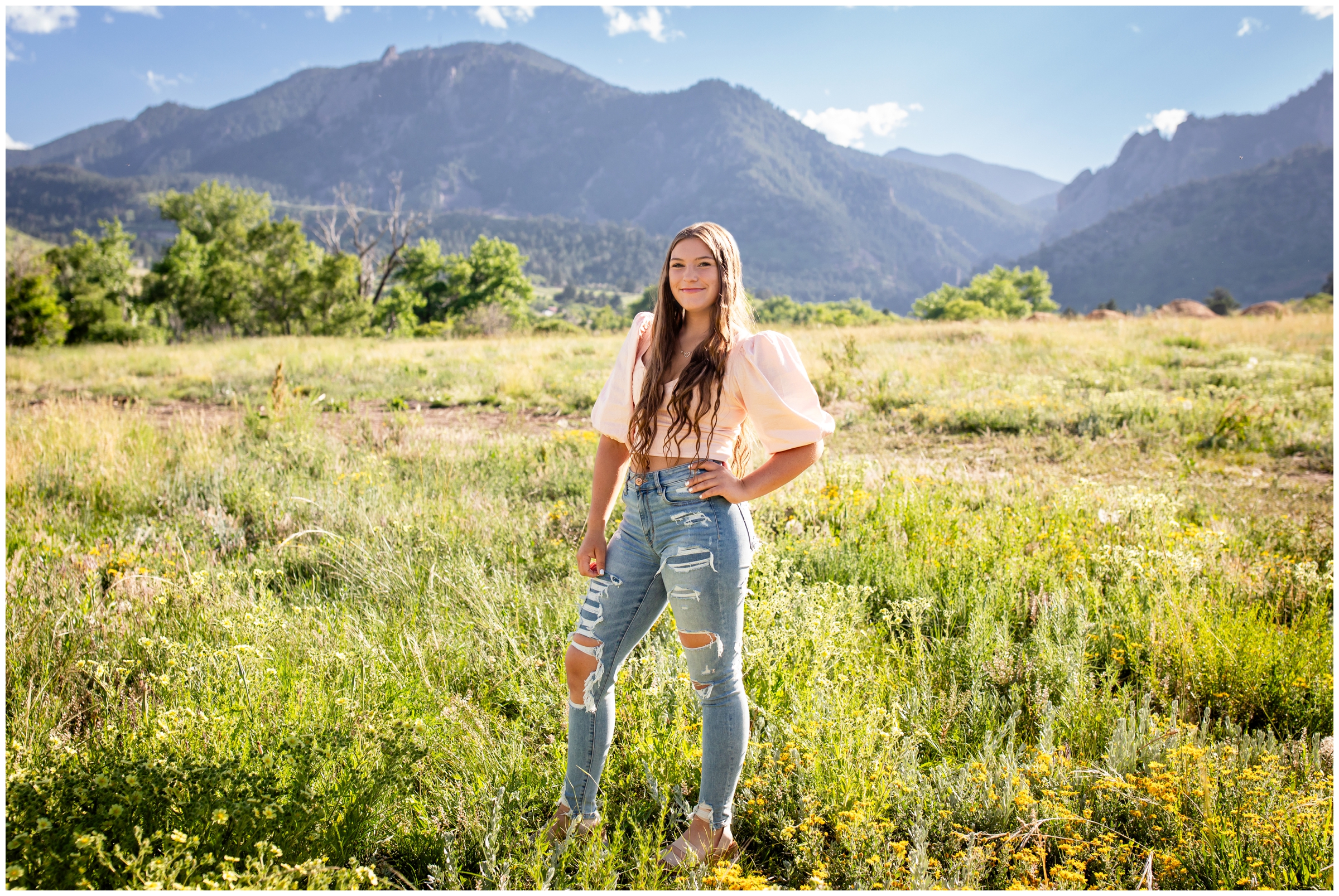 teen posing in mountain field during Boulder senior pictures at South Mesa Trail 