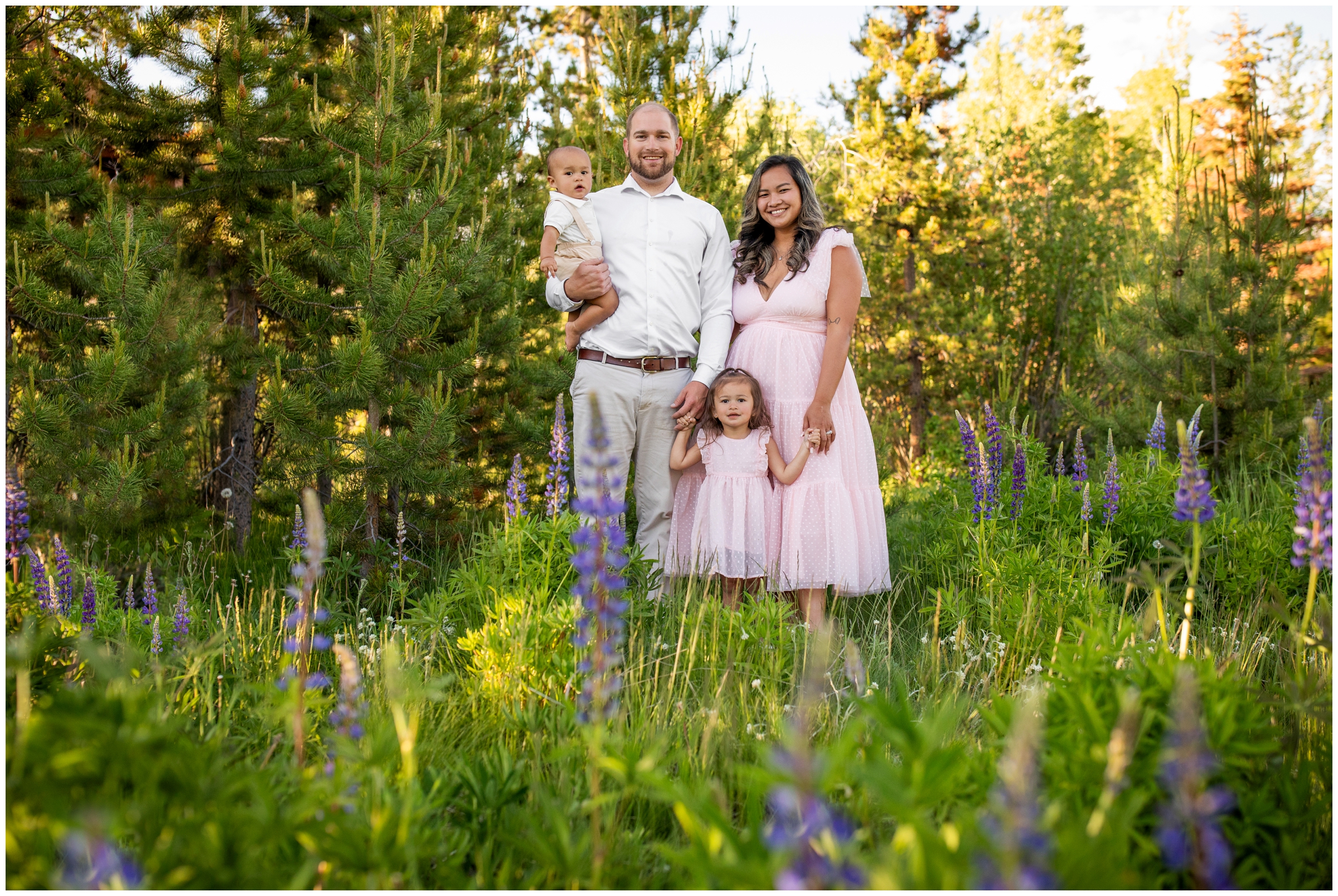 family posing in wildflower field during Grand Lake Colorado photography session 