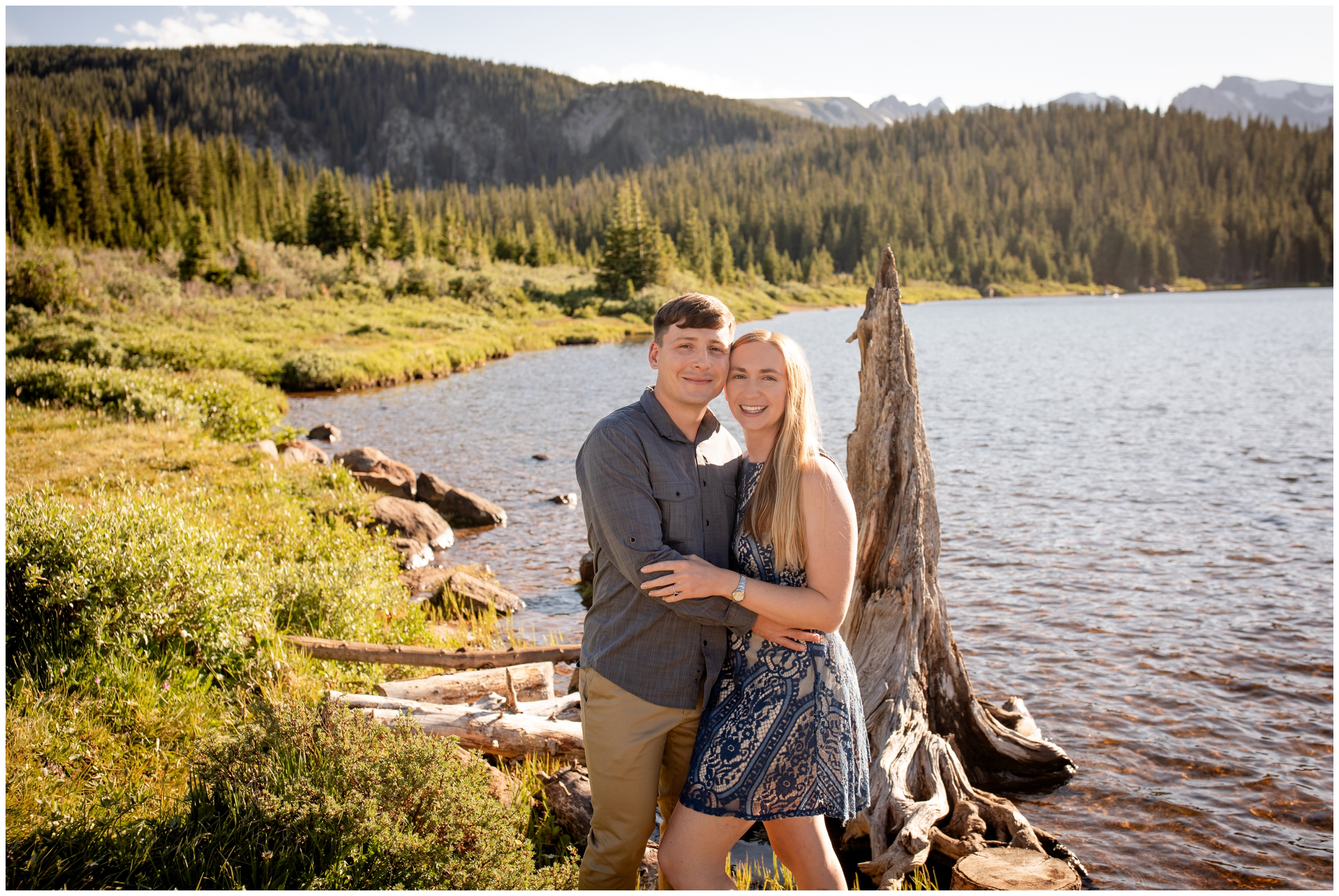 couple posing in front of Brainard Lake in CO