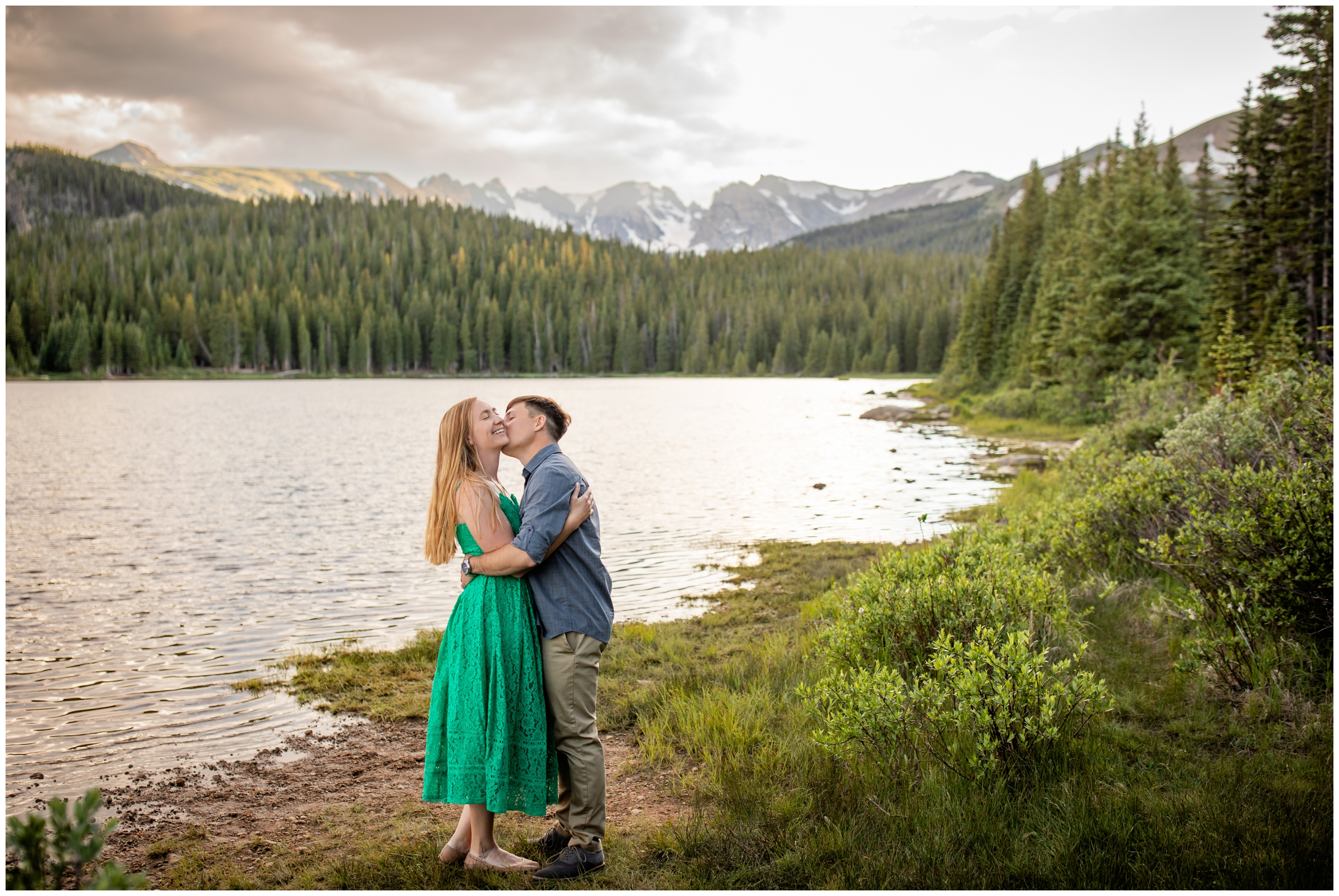 couple kissing next to Brainard Lake during summer engagement session in the Colorado mountains 