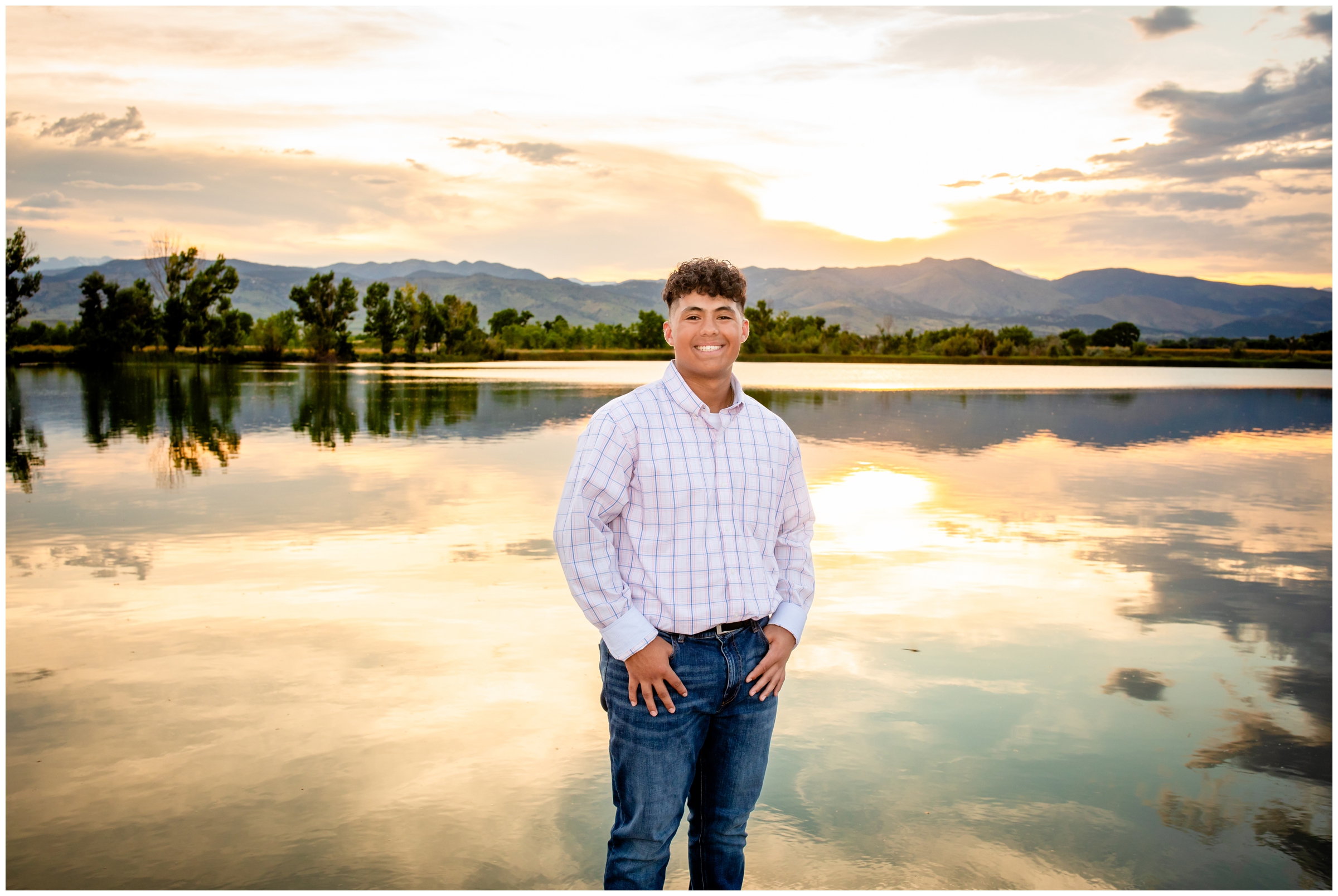 teen posing in front of Coot Lake at sunset during Skyline High Longmont senior pictures