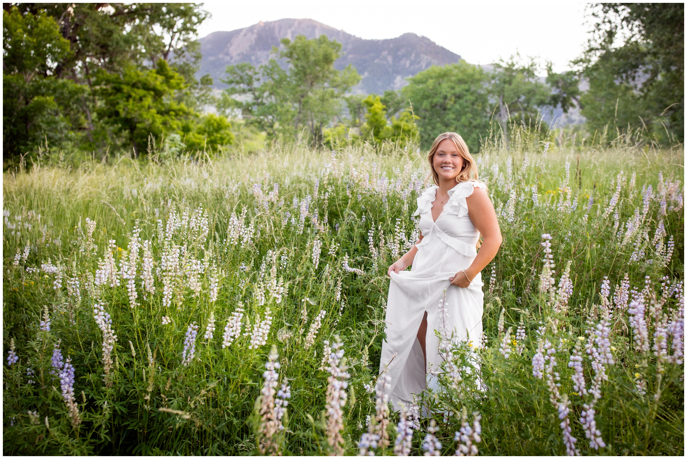 teen twirling in wildflower field during Boulder Colorado summer senior pictures by Plum Pretty Photography