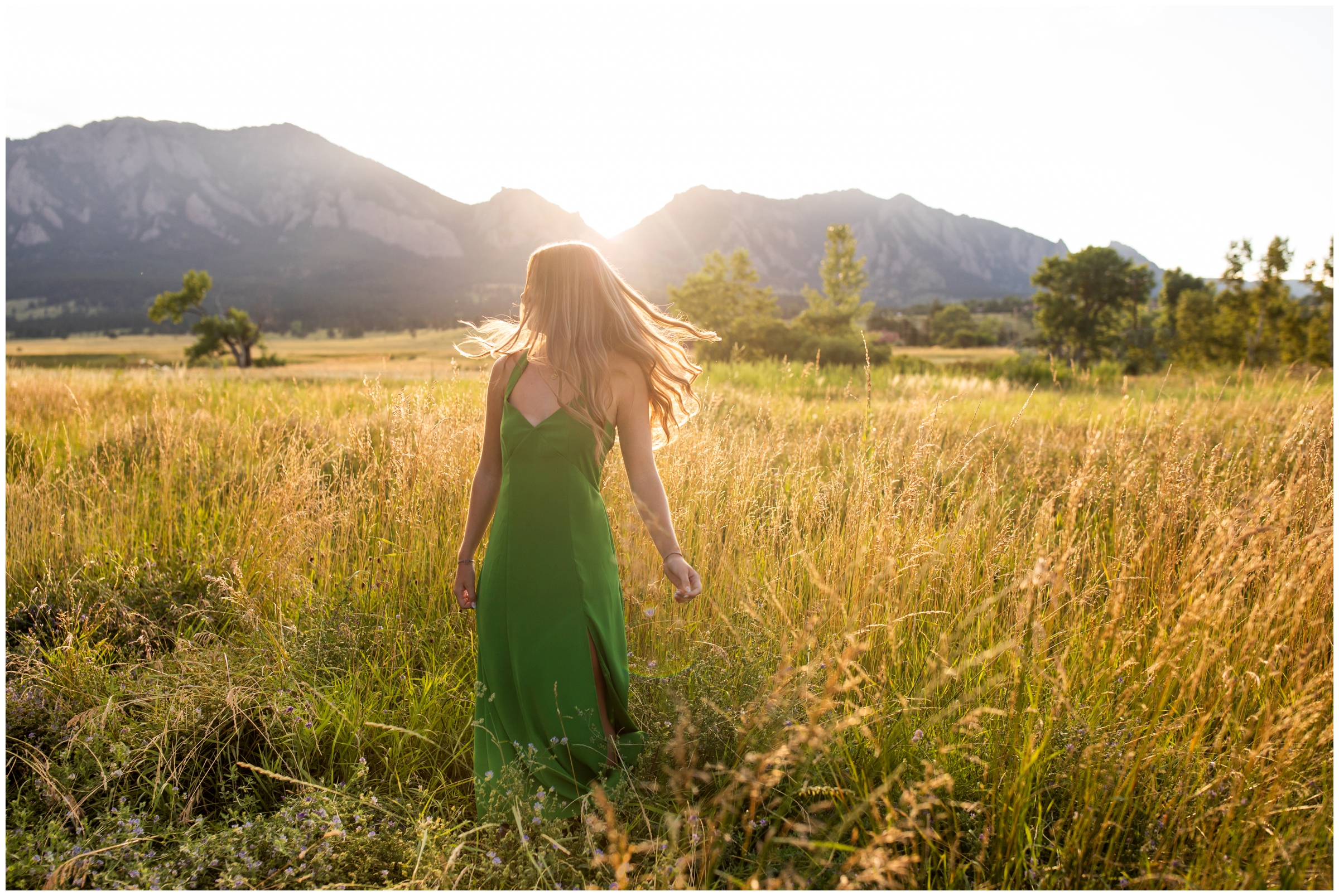 teen girl twirling in a field at sunset during Colorado mountain senior photos at South Boulder Creek West