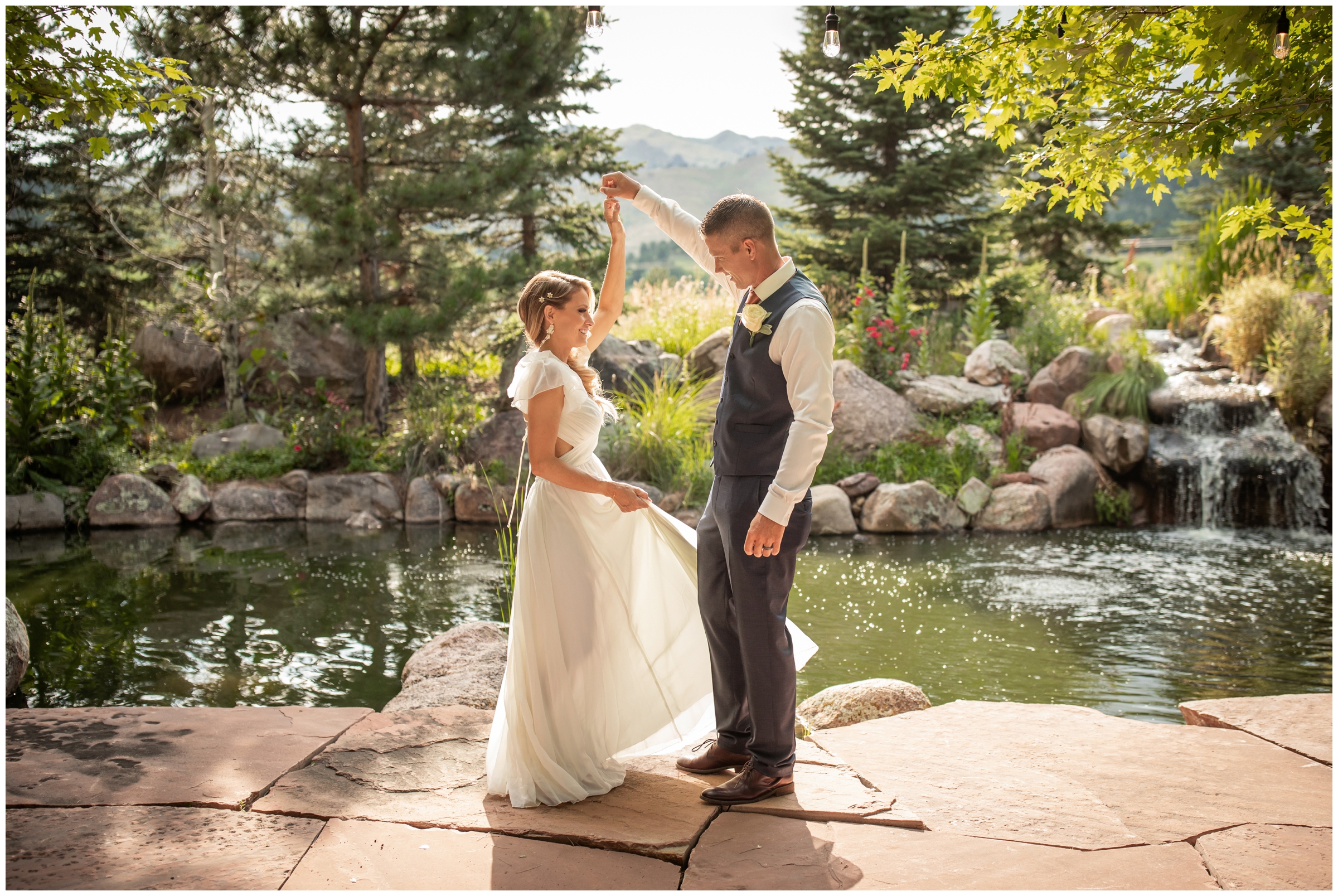 bride and groom dancing in front of ponds during Boulder Colorado wedding photography at the Greenbriar Inn