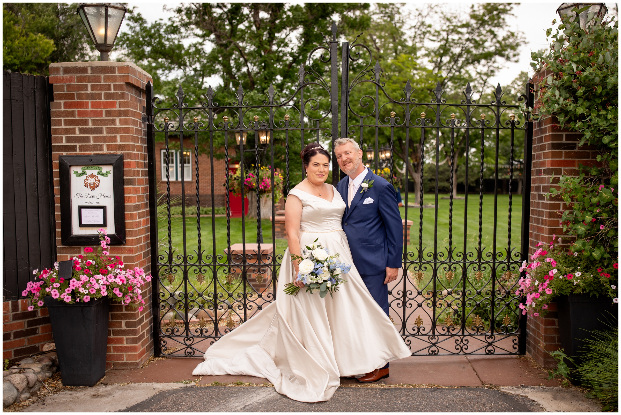 couple posing in front of wrought iron gates during Colorado wedding pictures at Dove House and the Chandelier Barn 
