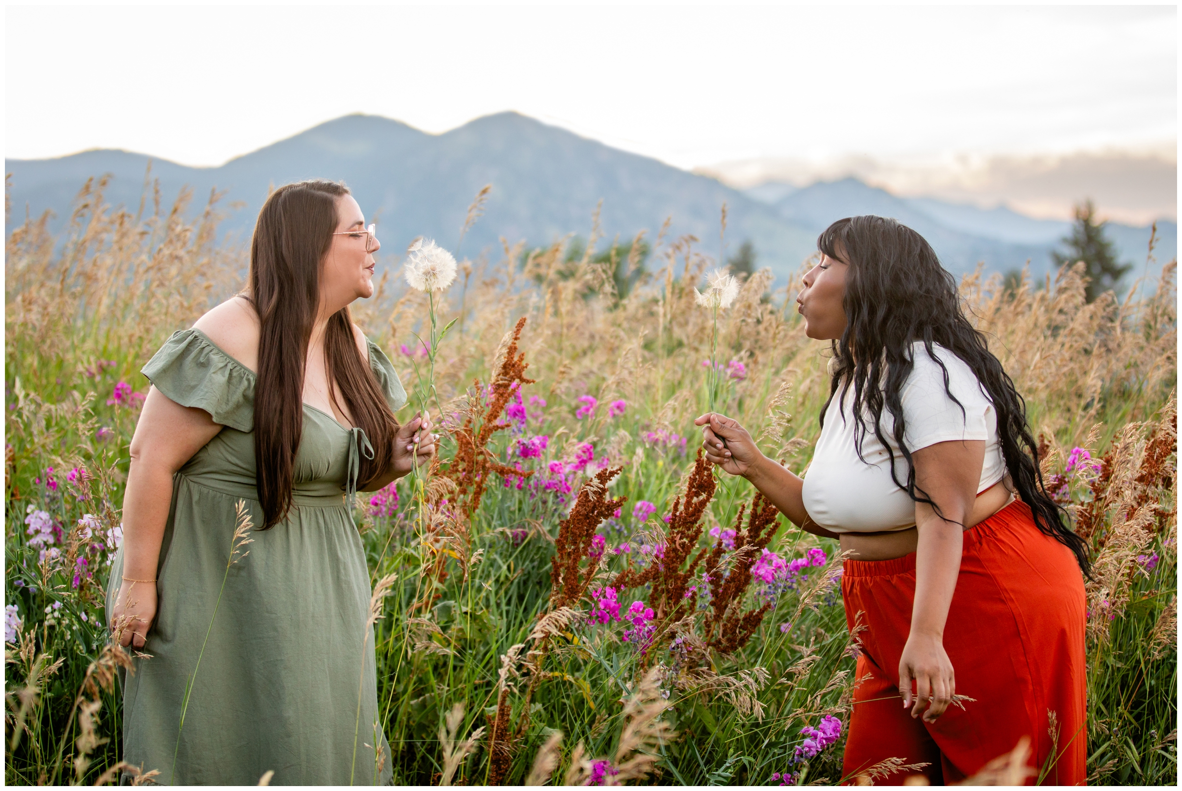ladies blowing on dandelions during Boulder photography session by Plum Pretty photos