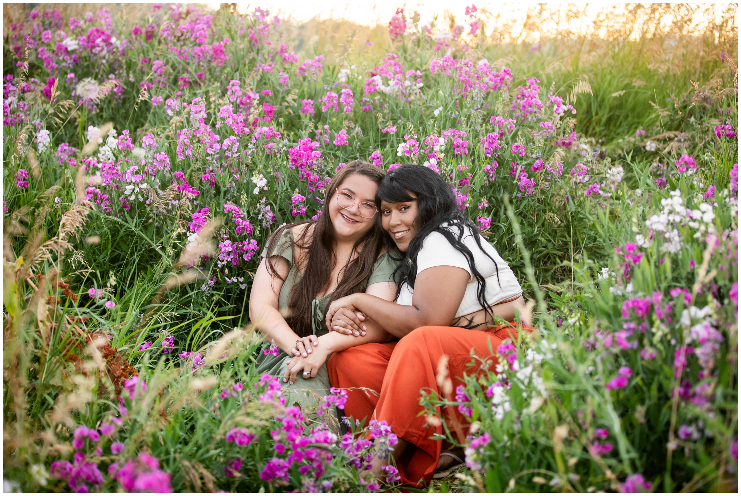 best friends sitting in wildflowers at Chautauqua during Boulder Colorado portrait photos 