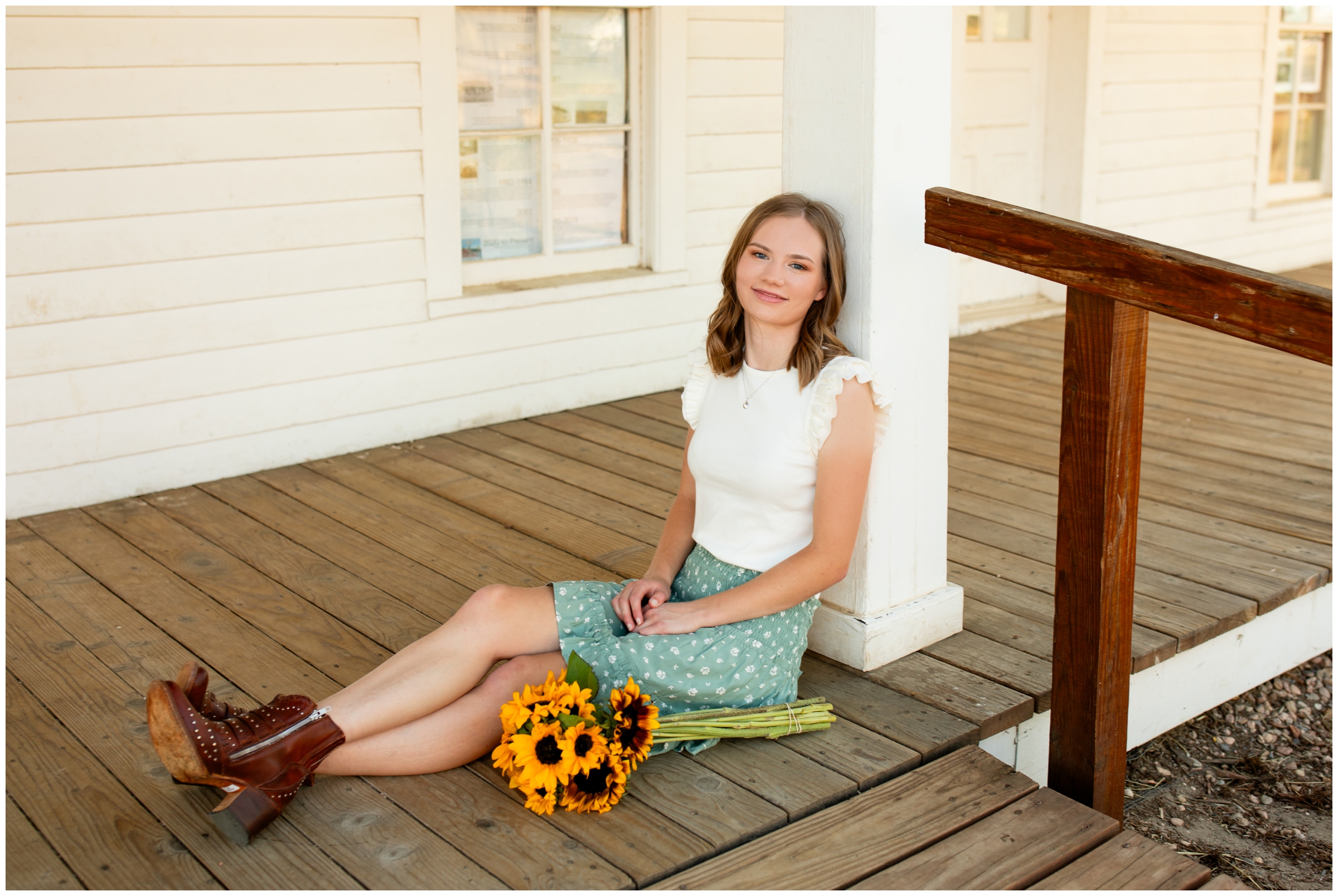 teen sitting on porch during farm senior pictures in Centennial Colorado 