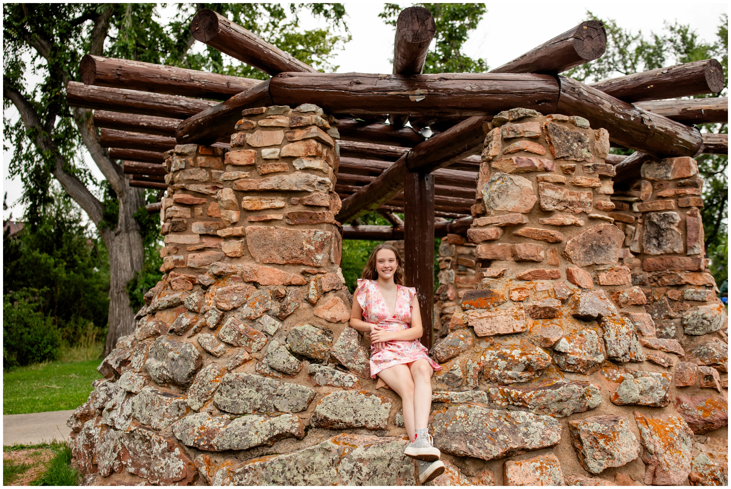 teen posing in stone structure at Chautauqua during Boulder senior pictures 