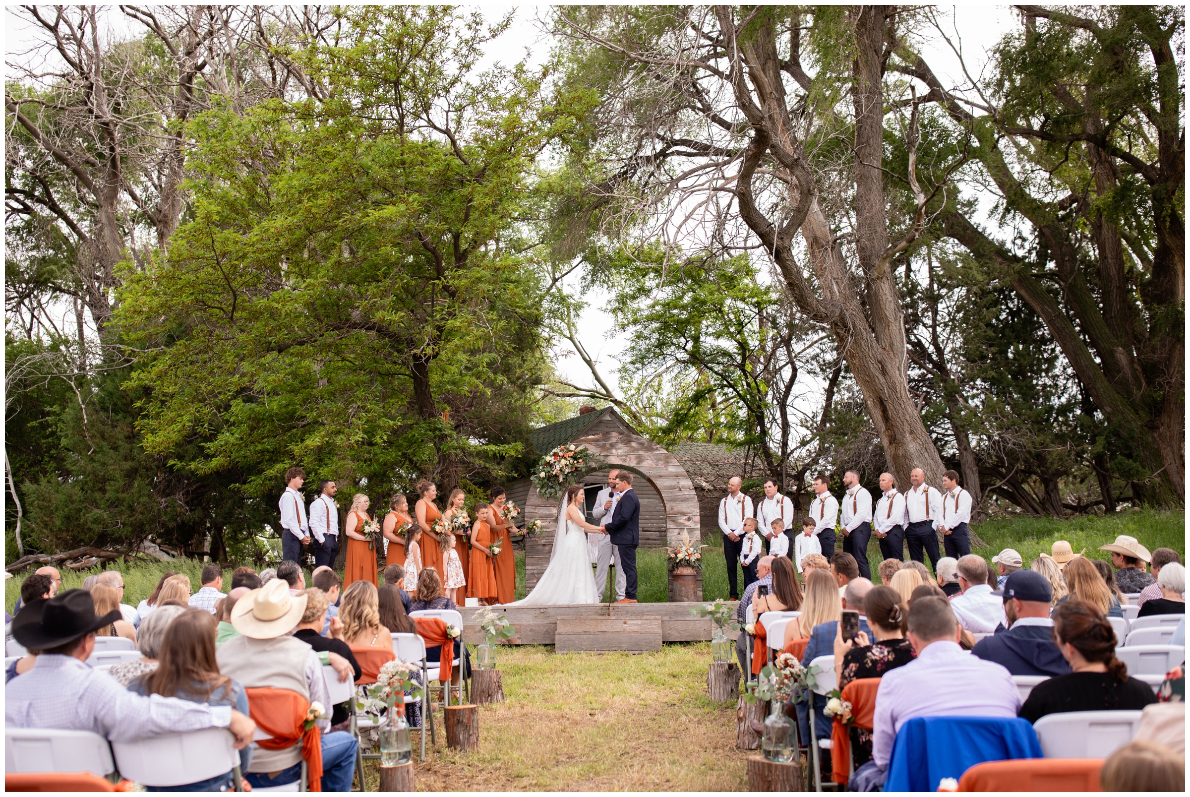 rustic farm wedding ceremony during summer in Crook Colorado 