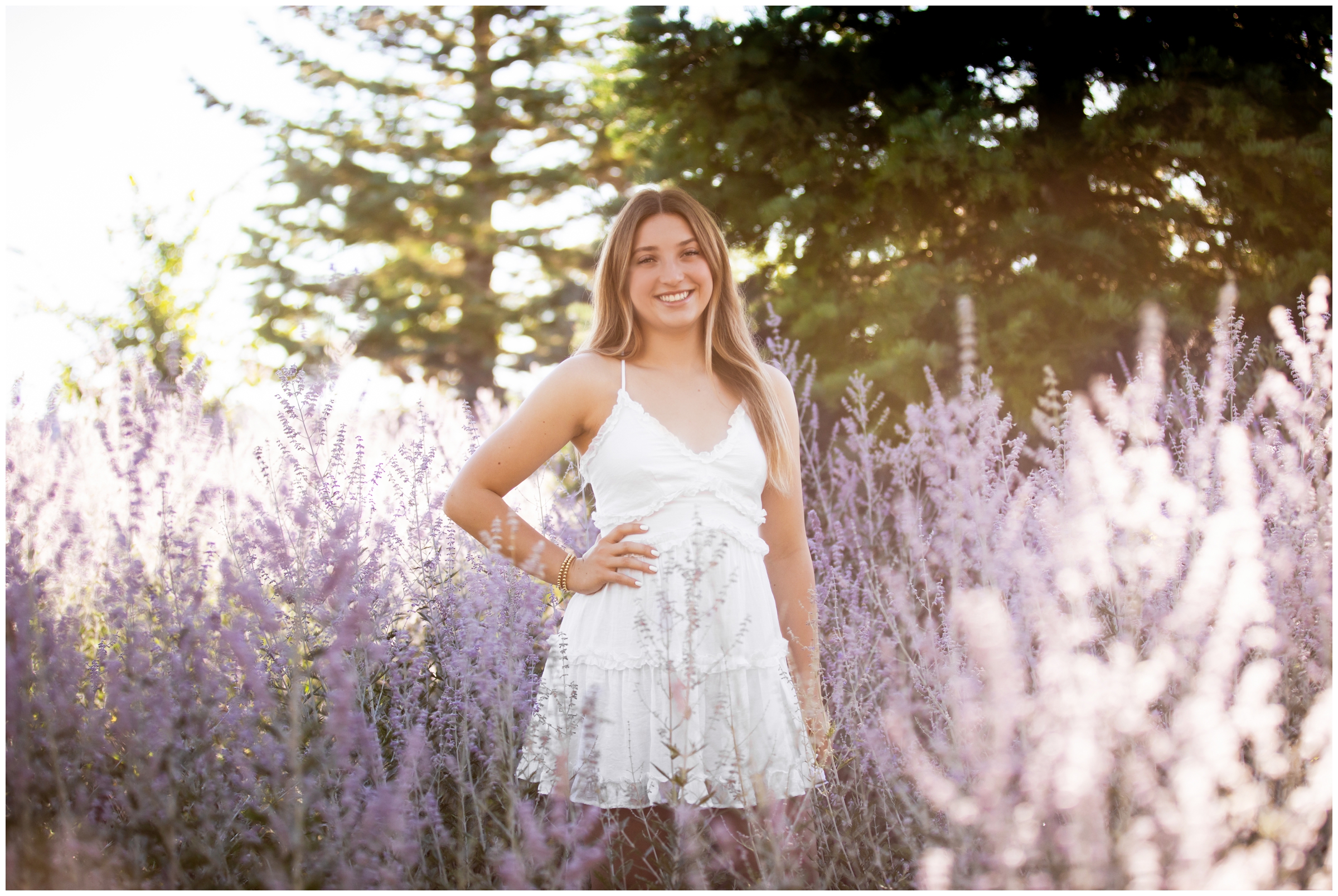 teen posing in a lavender flower field during Broomfield Colorado senior portraits by Plum Pretty Photography