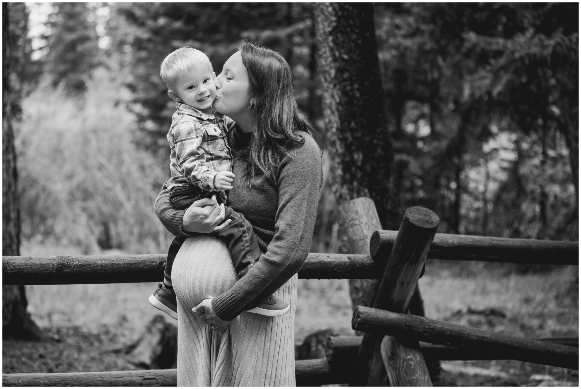 mom kissing son during family photography session in Idaho Springs