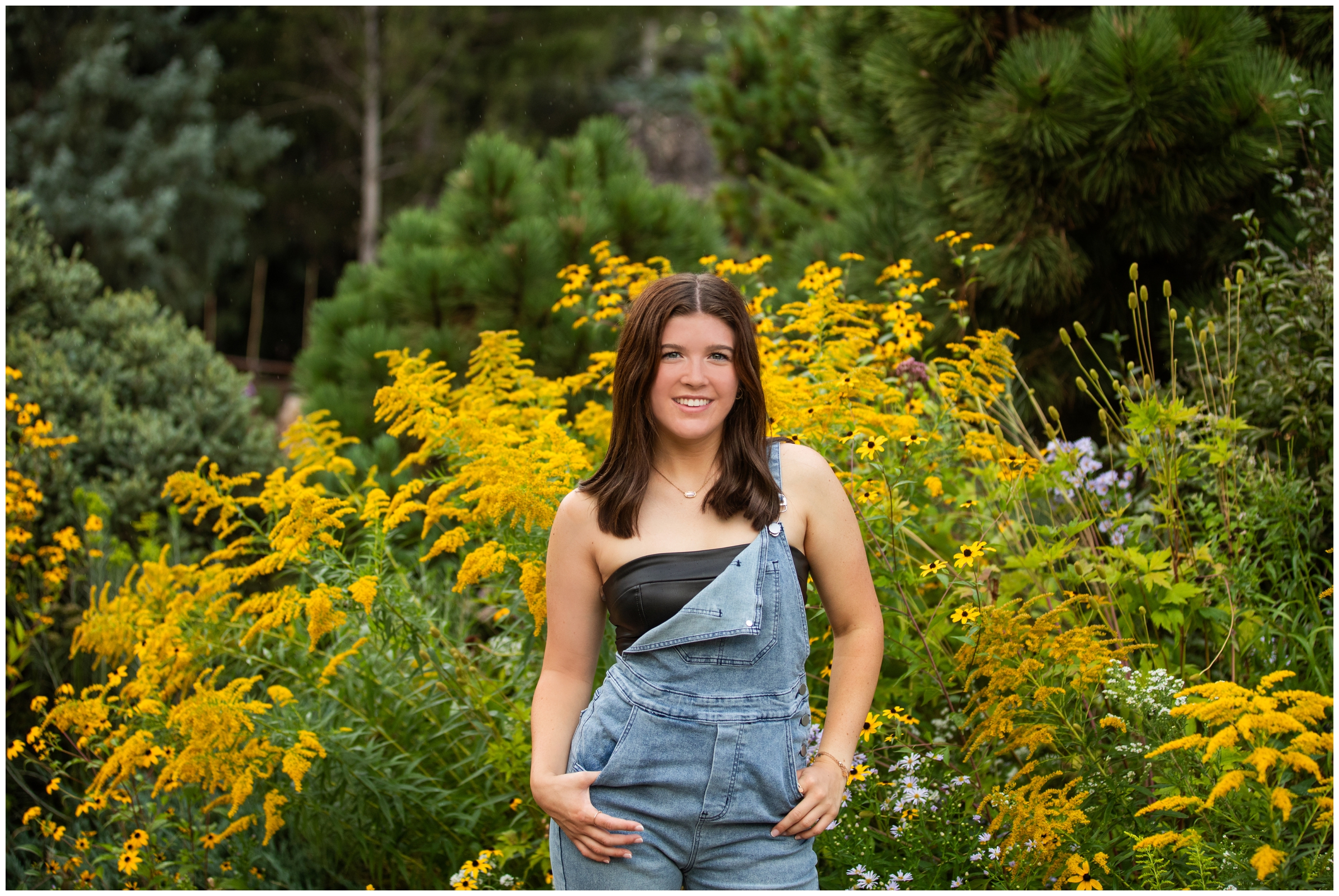 teen posing in front of colorful florals during Denver Colorado botanic gardens senior pictures 