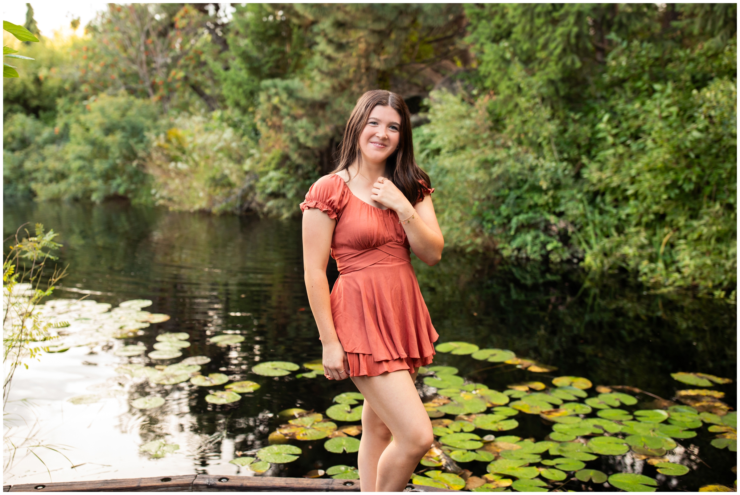 high school graduation photography session next to a lily pond in Colorado by Plum Pretty Photography 