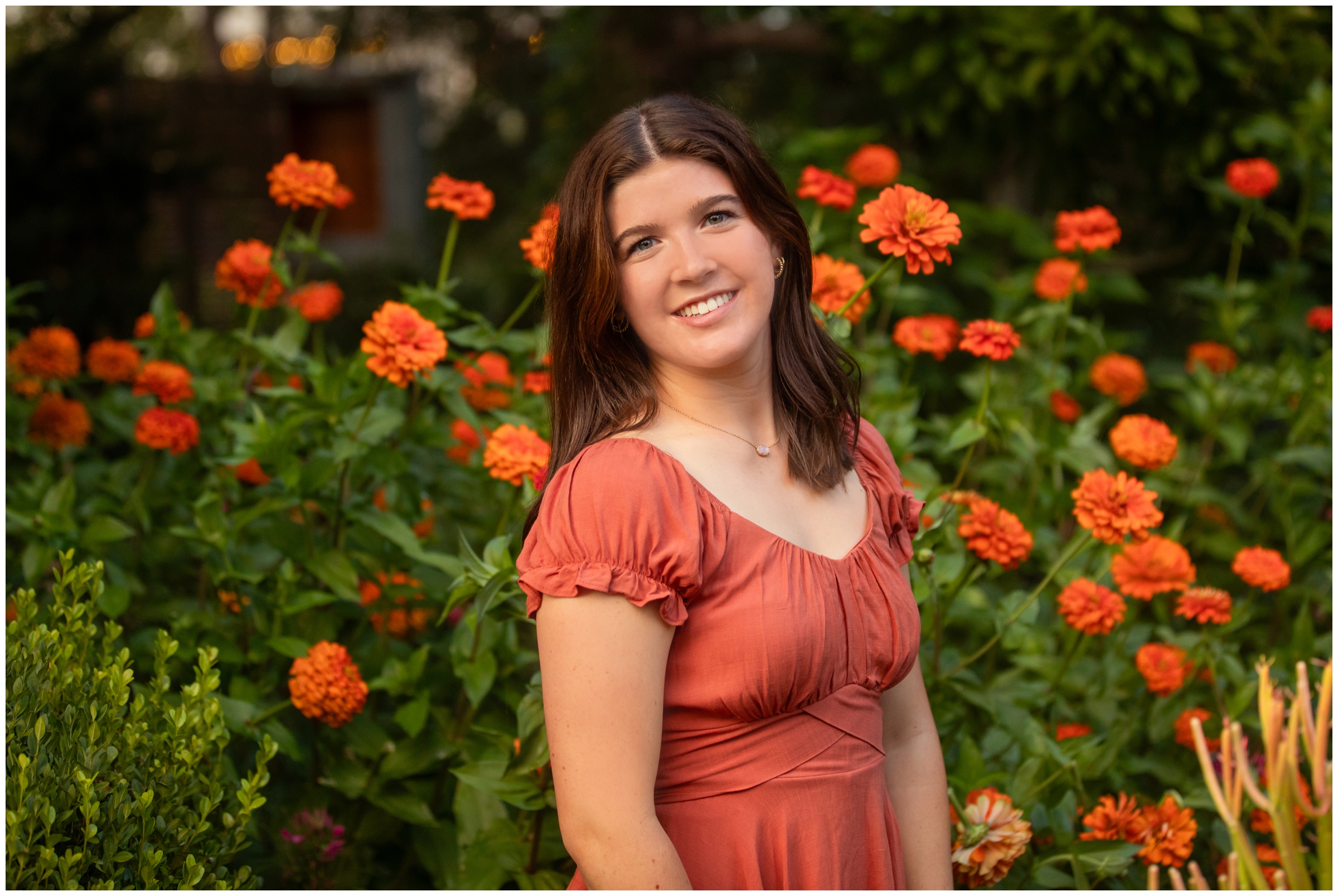 teen girl posing in front of colorful flowers during Denver Botanic Gardens photography session 