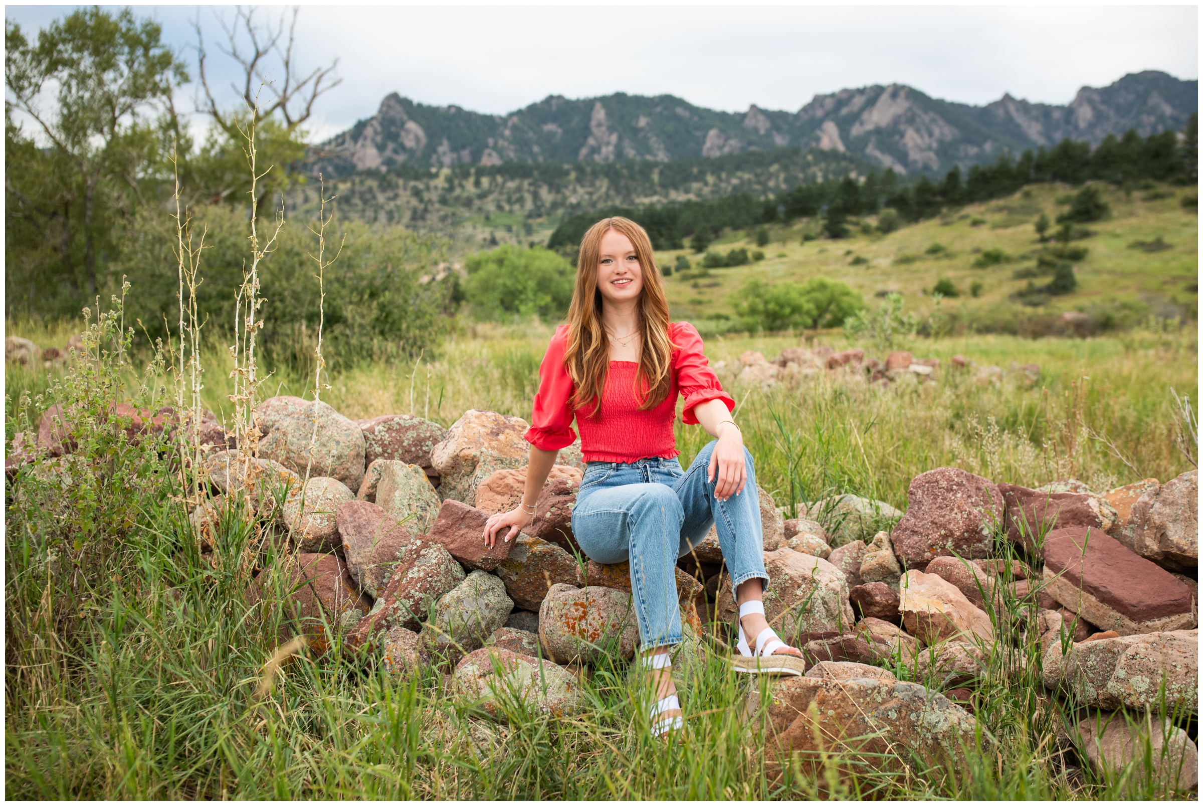 teen posing on rocks at South Mesa Trail during Boulder Colorado senior pictures