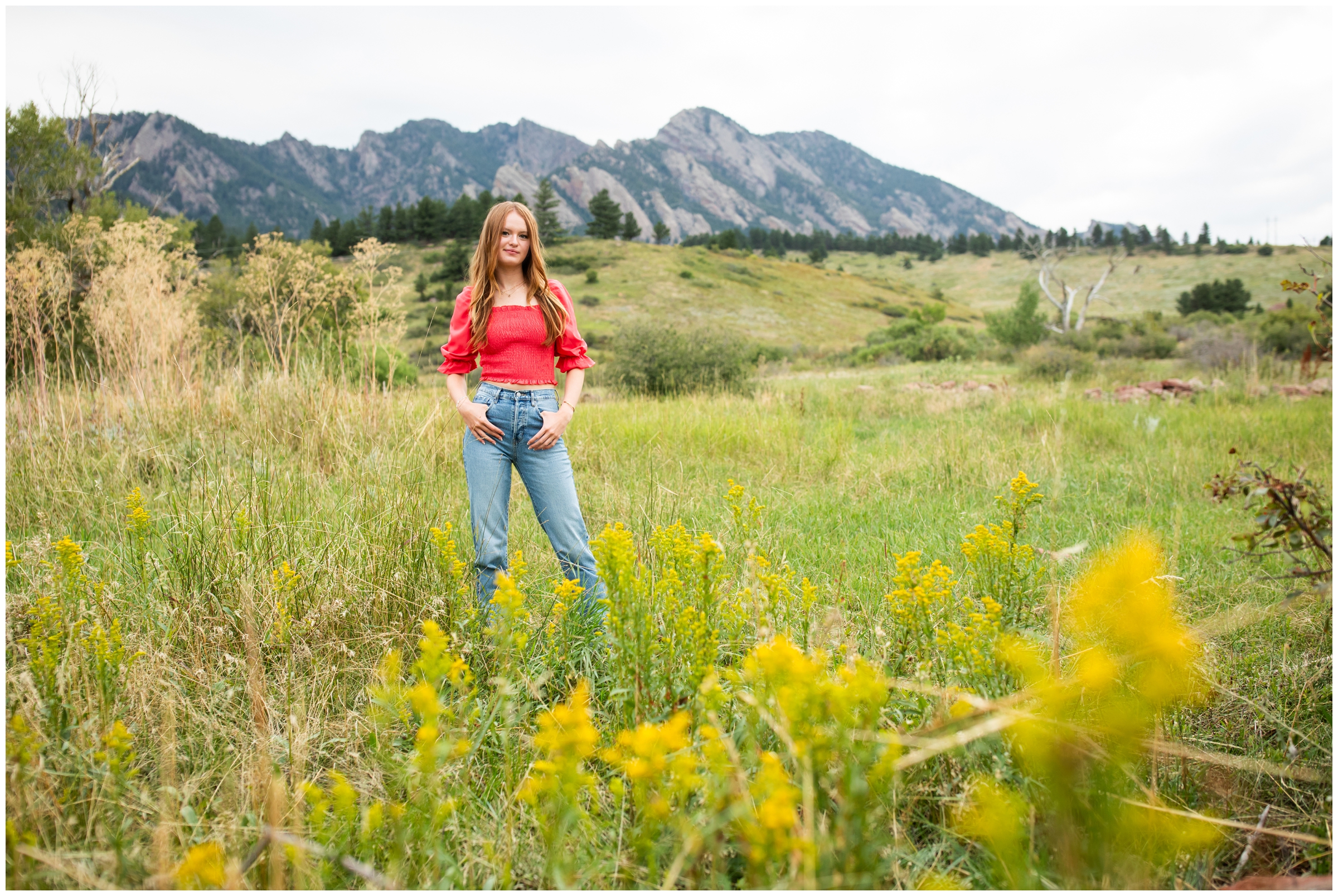 teen posing in field of wildflowers during Boulder Colorado mountain senior pictures 