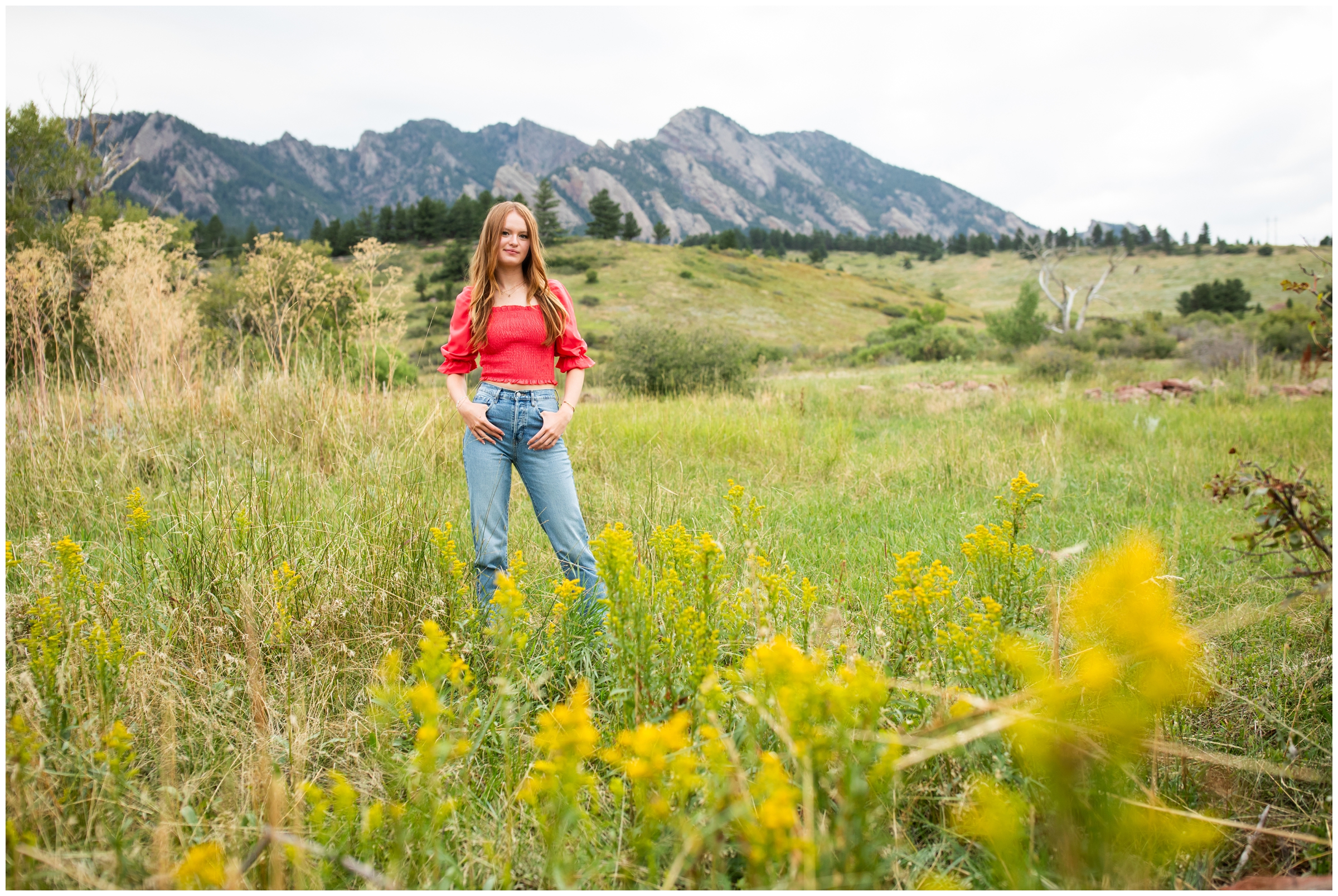 teen posing in field of wildflowers during Boulder Colorado mountain senior pictures