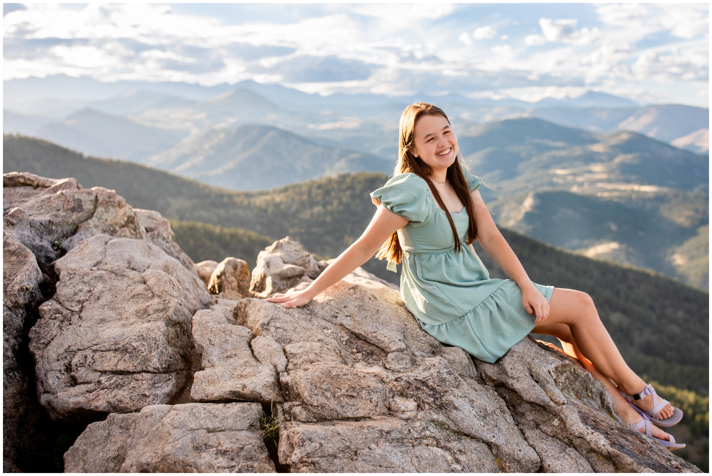 high school student sitting on rock during graduation photography session at Lost Gulch Overlook