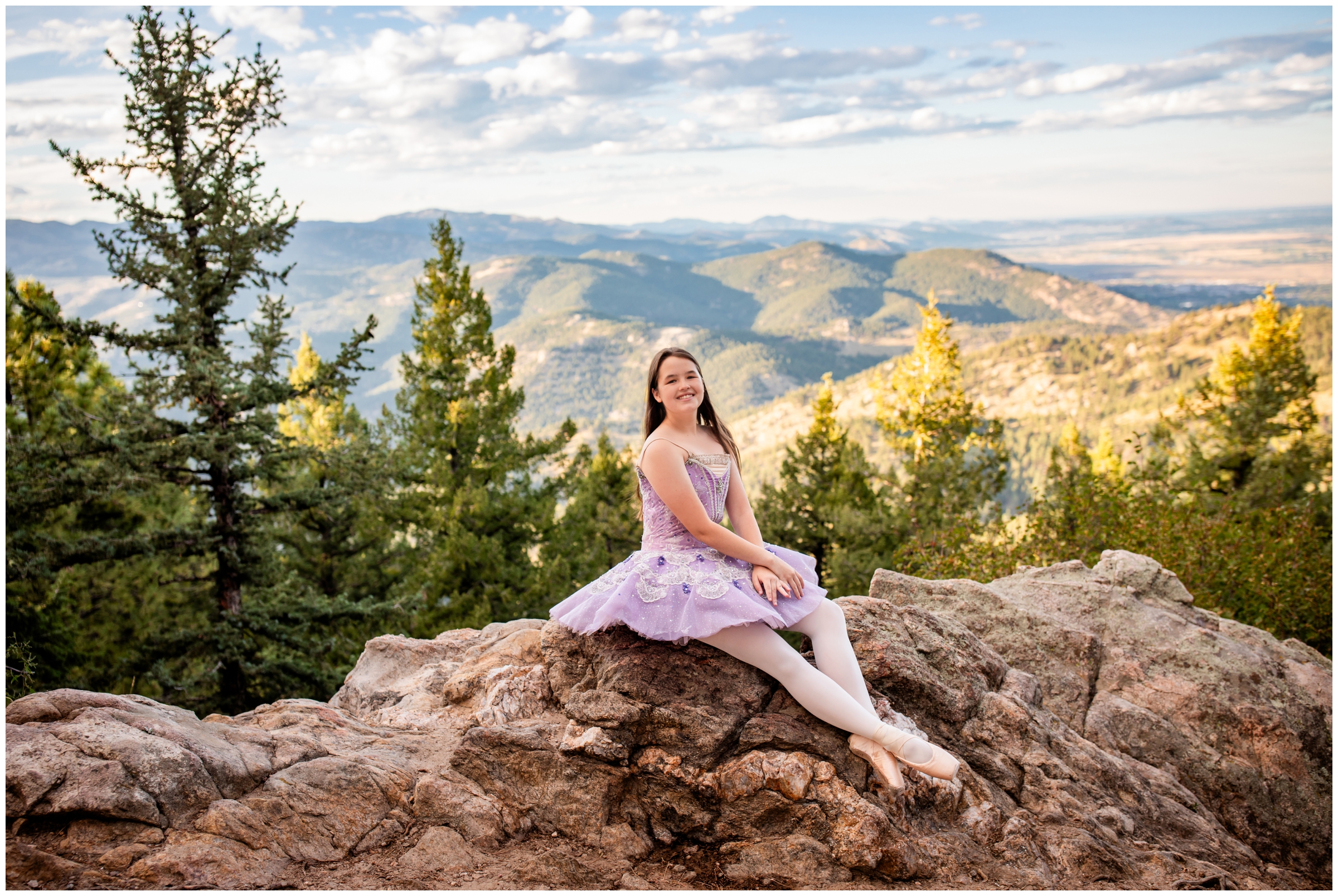 ballerina posing on rock formations during dance senior pictures in Boulder Colorado 