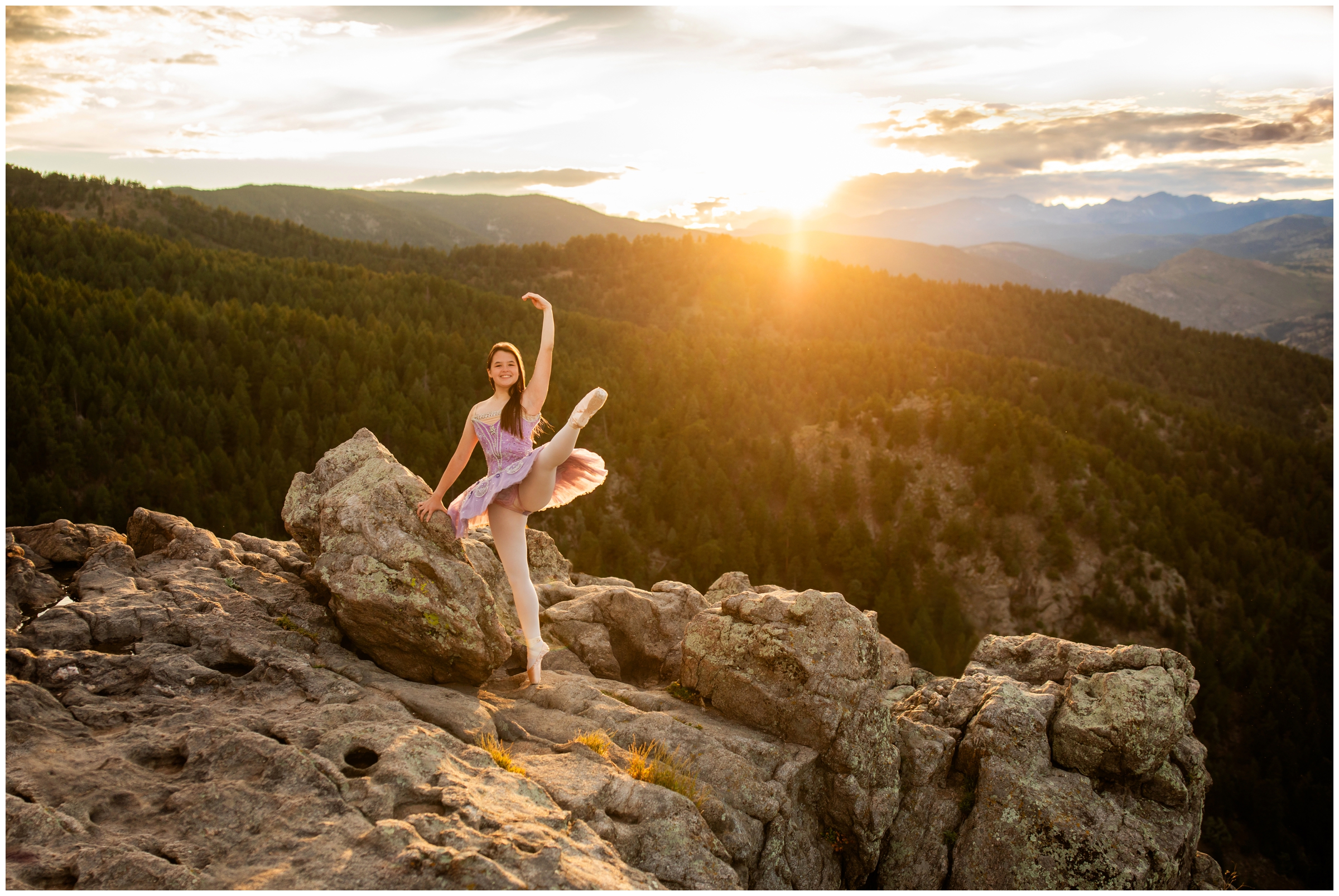 ballerina posing on the edge of a mountain during Boulder Colorado senior pictures by Plum Pretty Photography 