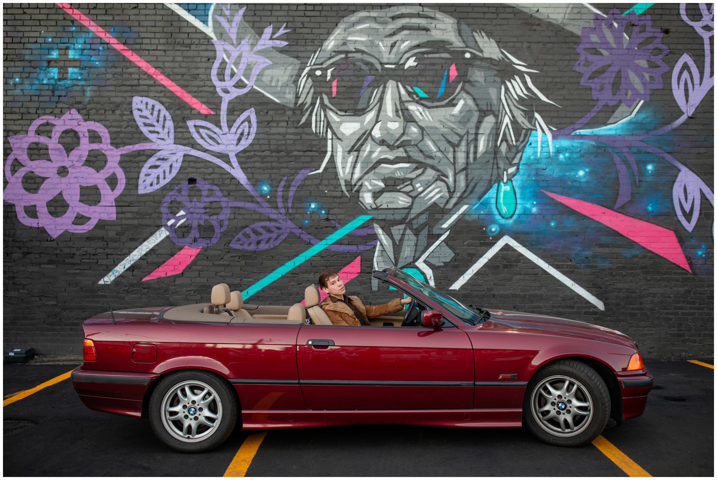 teen posing in his BMW during senior portraits in Denver Colorado by Plum Pretty Photography 