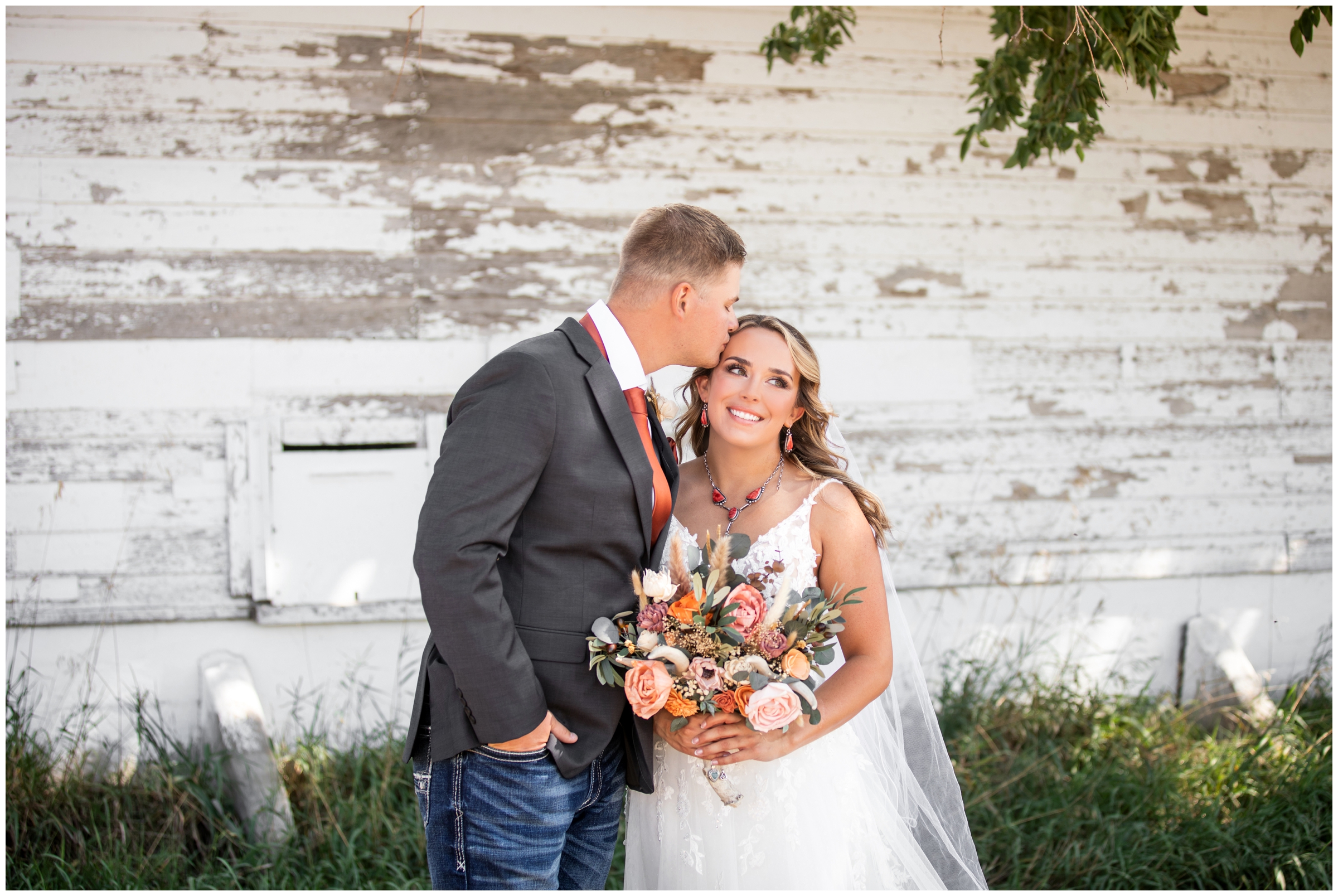 rustic wedding portraits in front of a barn in Haxtun Colorado by Plum Pretty Photography 