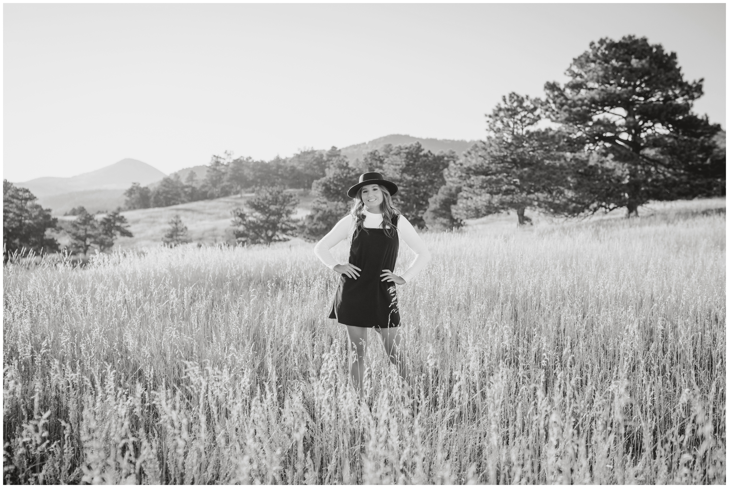 teen posing in open field during Holy Family senior portraits at Betasso Preserve by Boulder Colorado photographer Plum Pretty Photography