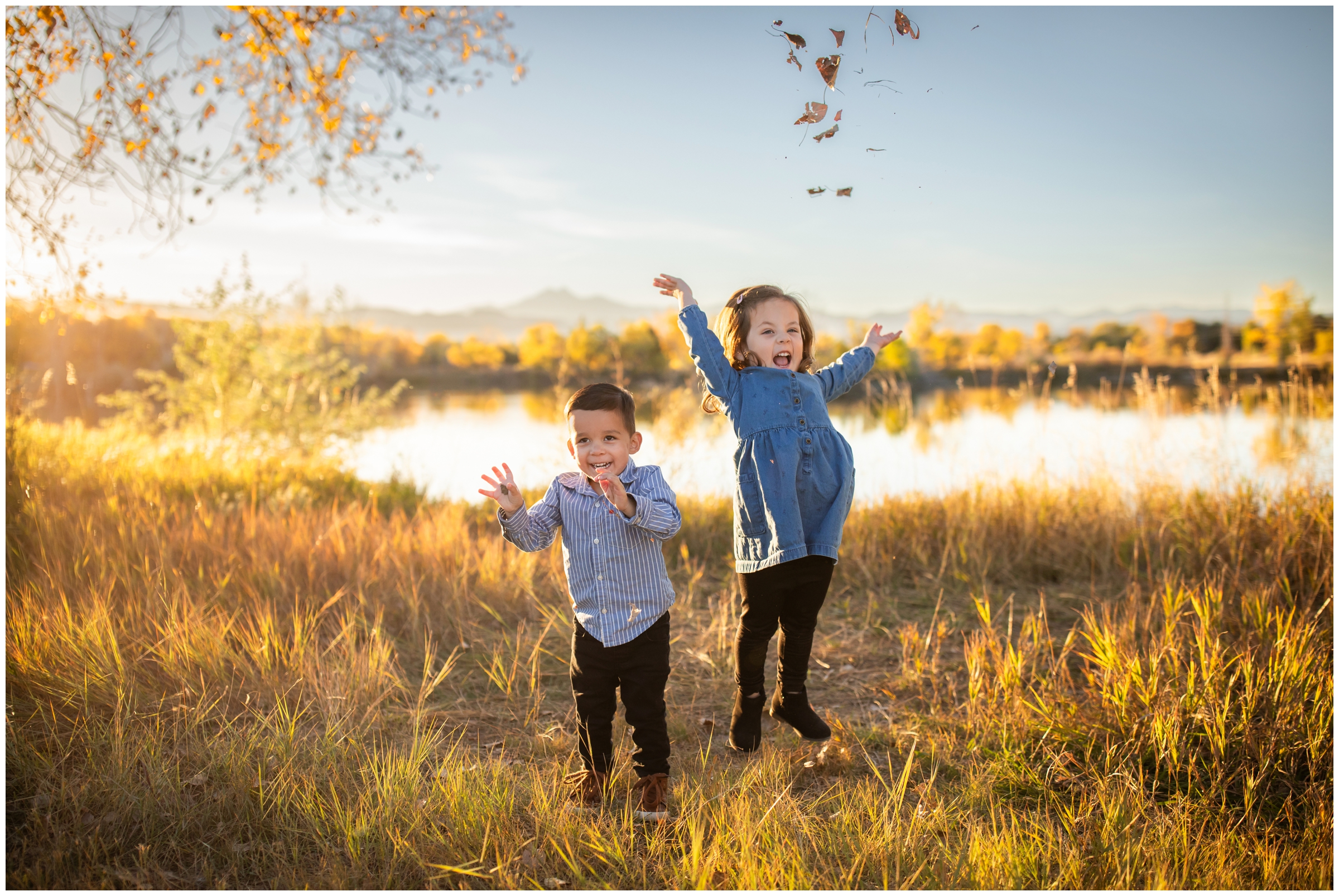 little kids throwing leaves in the air during candid Colorado family pictures by Plum Pretty Photography 