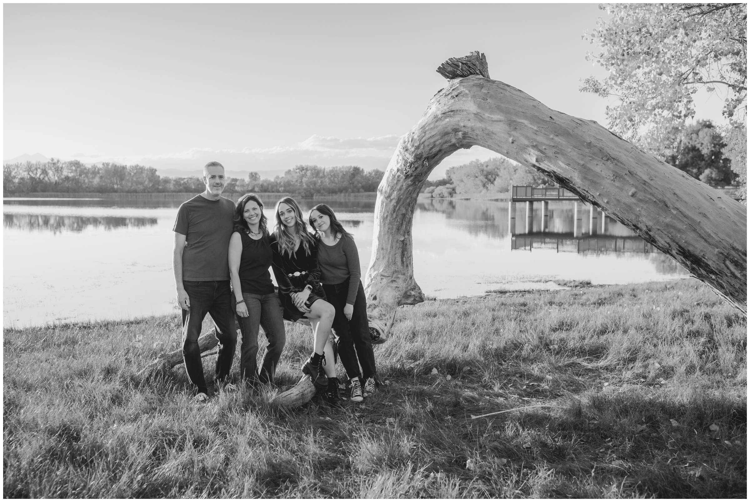 family posing on fallen tree during Mead Colorado family photography session by Plum Pretty Photography 