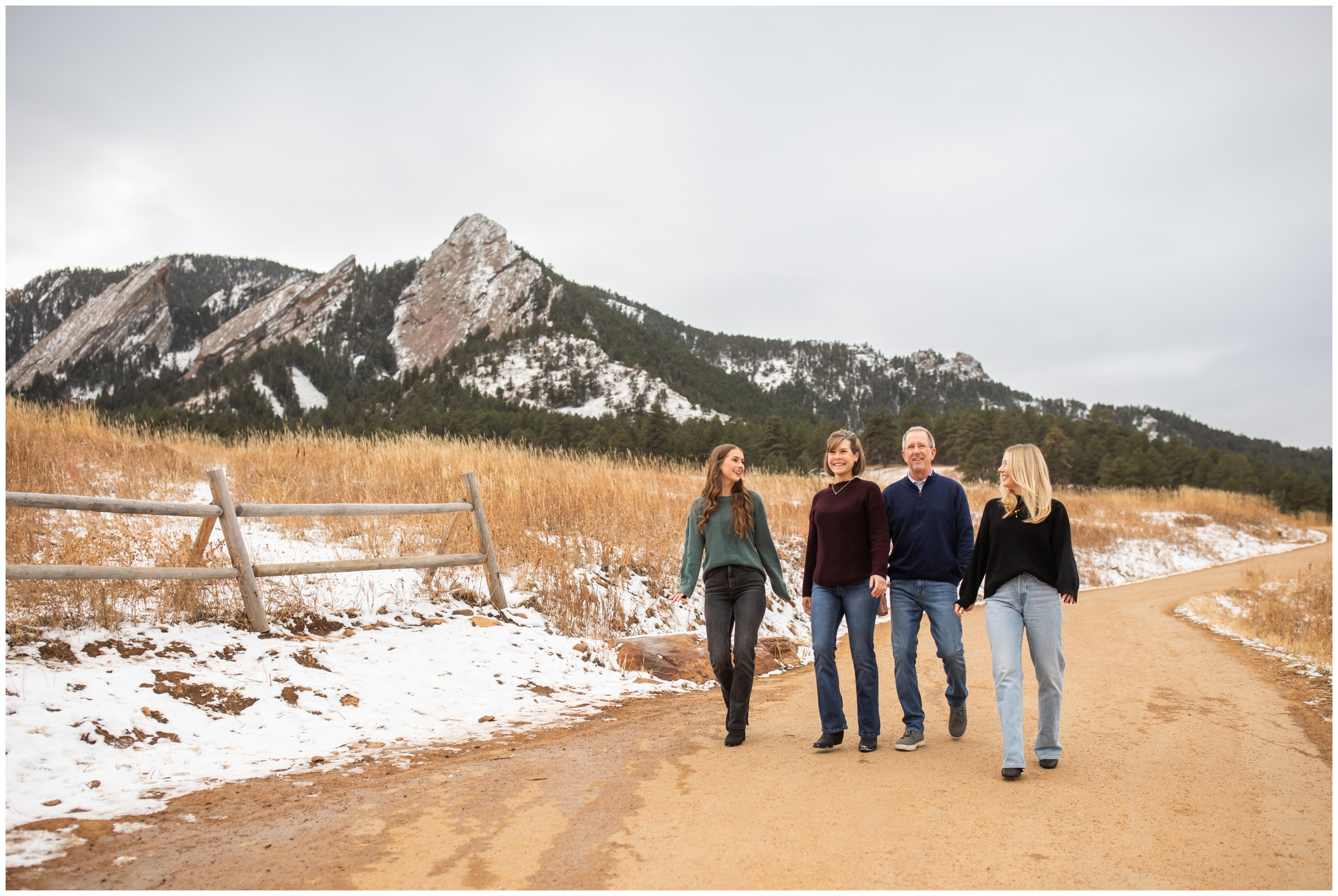 candid family photos of adults walking on trail at Chautauqua during winter family photography session in Boulder Colorado