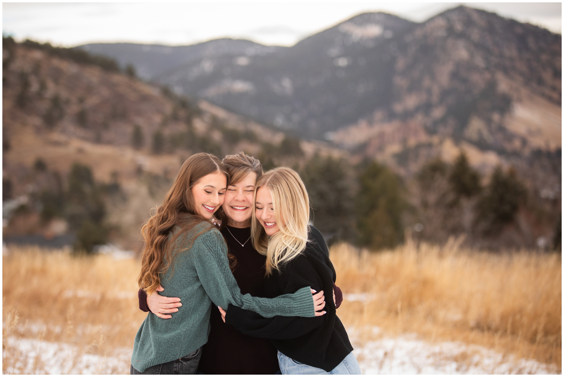 mom and daughters hugging during Colorado candid family photos at Chautauqua Boulder