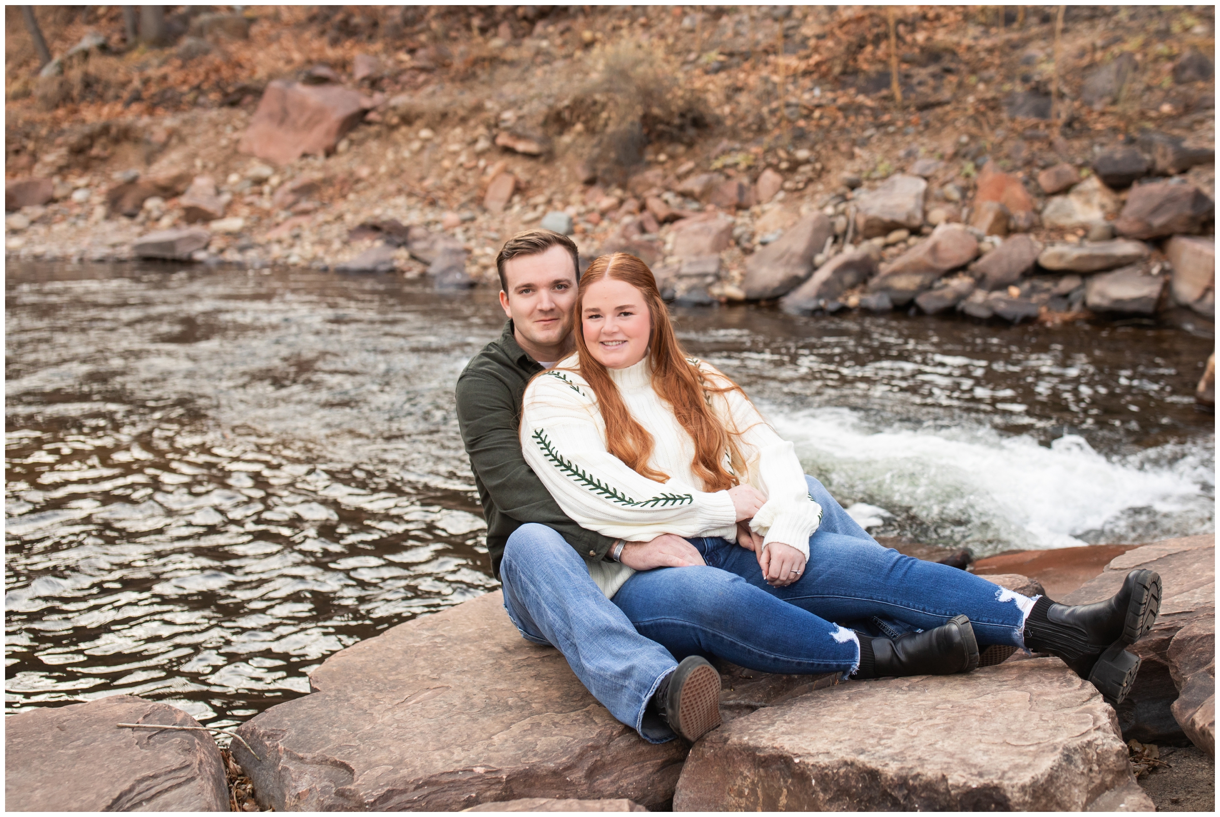 couple posing by river at the Lavern Johnson Park in the Colorado mountains during winter couple's photos