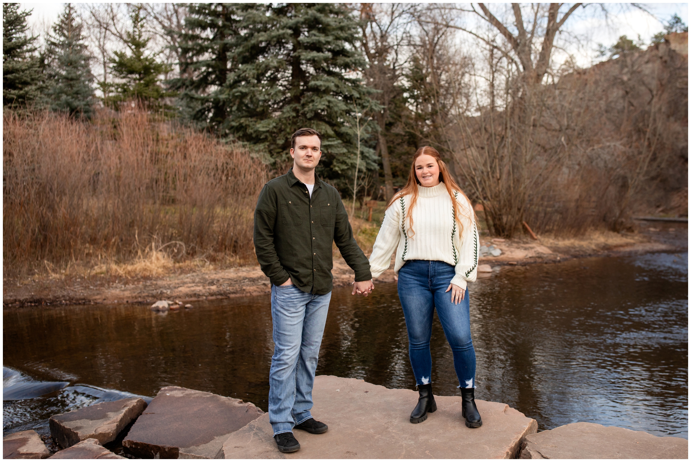 couple posing next to the St Vrain River during Lyons engagement pictures by Plum Pretty Photography