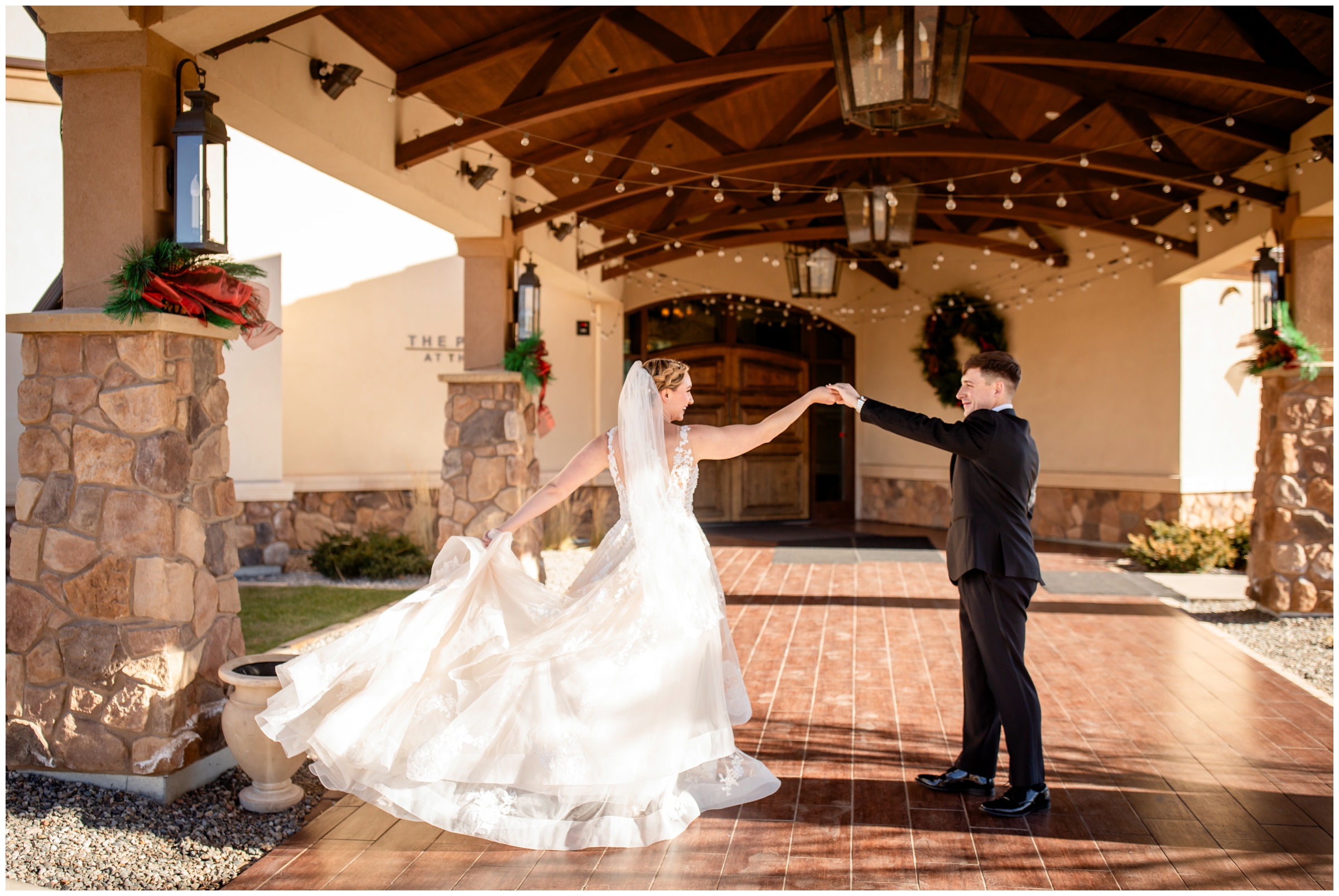 groom spinning bride during winter wedding photos at the Pinery in Colorado Springs