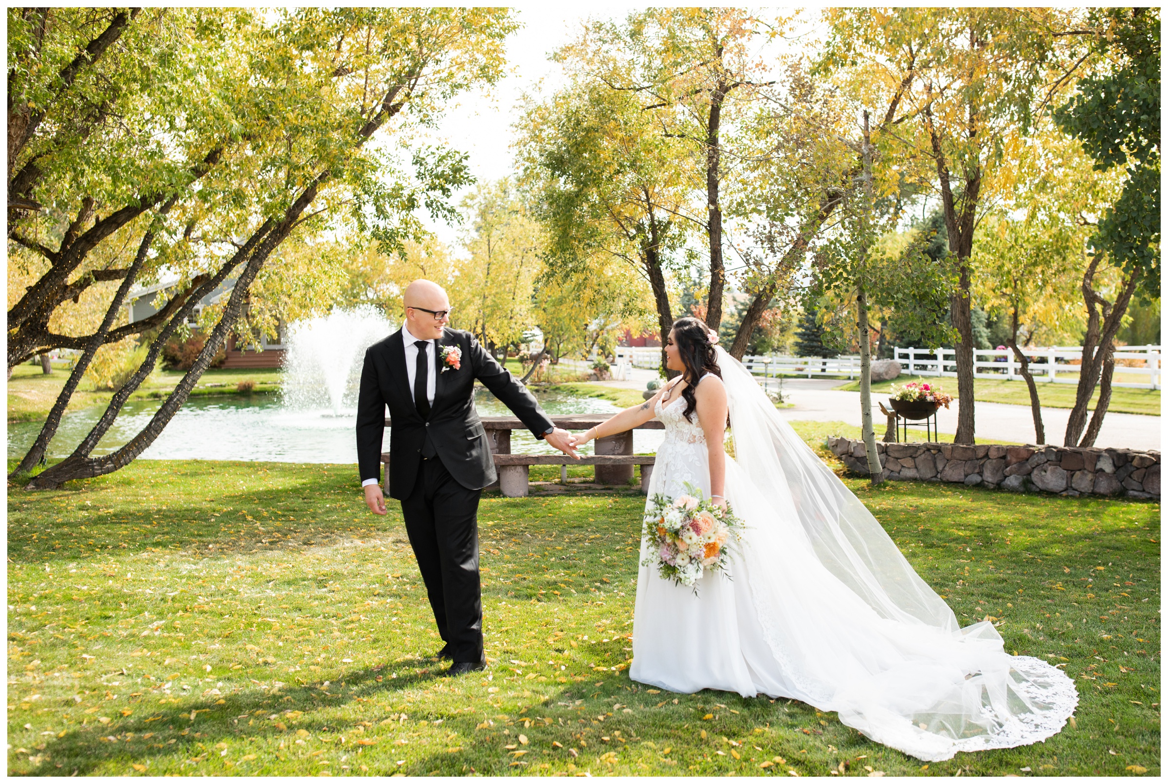 bride and groom holding hands and walking during candid wedding photos at the venue at Crooked Willow Farms