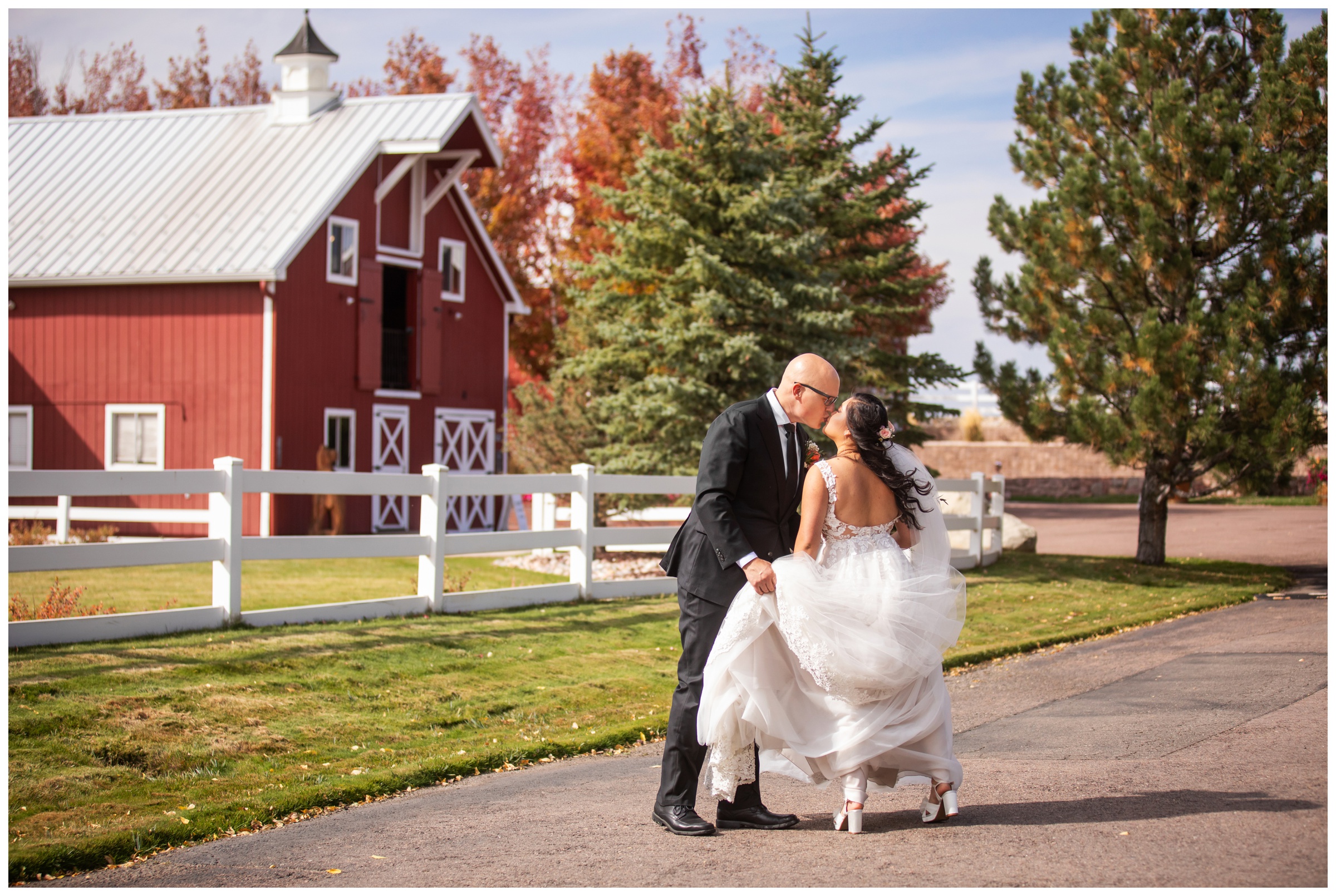 couple kissing during Colorado candid wedding photos at the venue at Crooked Willow Farms