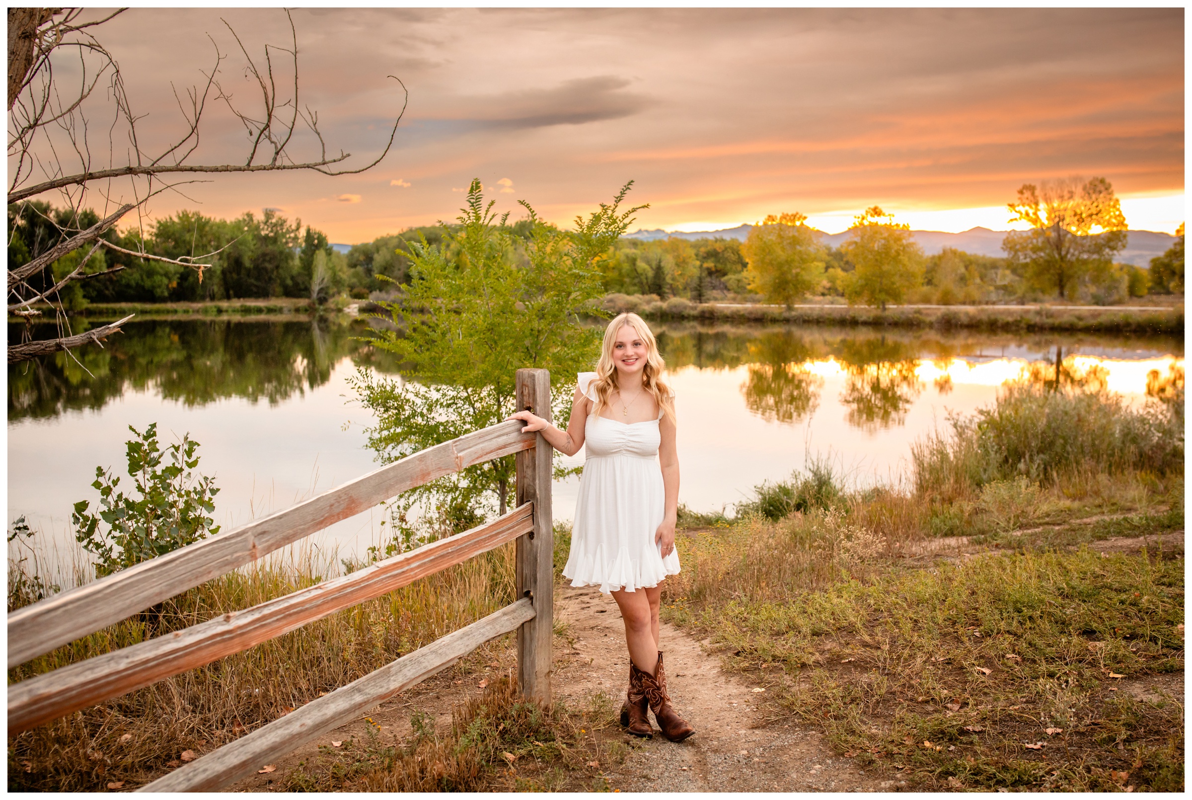 teen posing by mountain lake at sunset during Longmont Colorado senior photos by Plum Pretty Photography