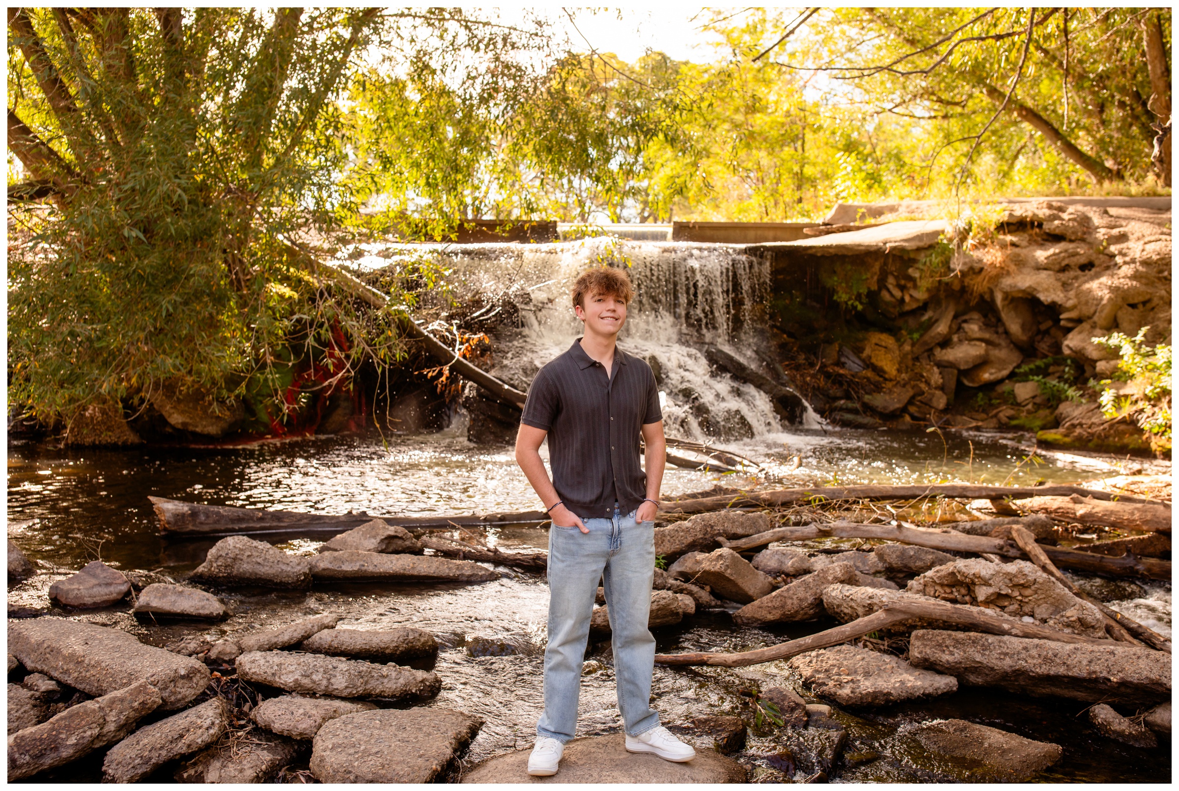teen standing by waterfall at Golden Ponds Nature Area in Longmont Colorado