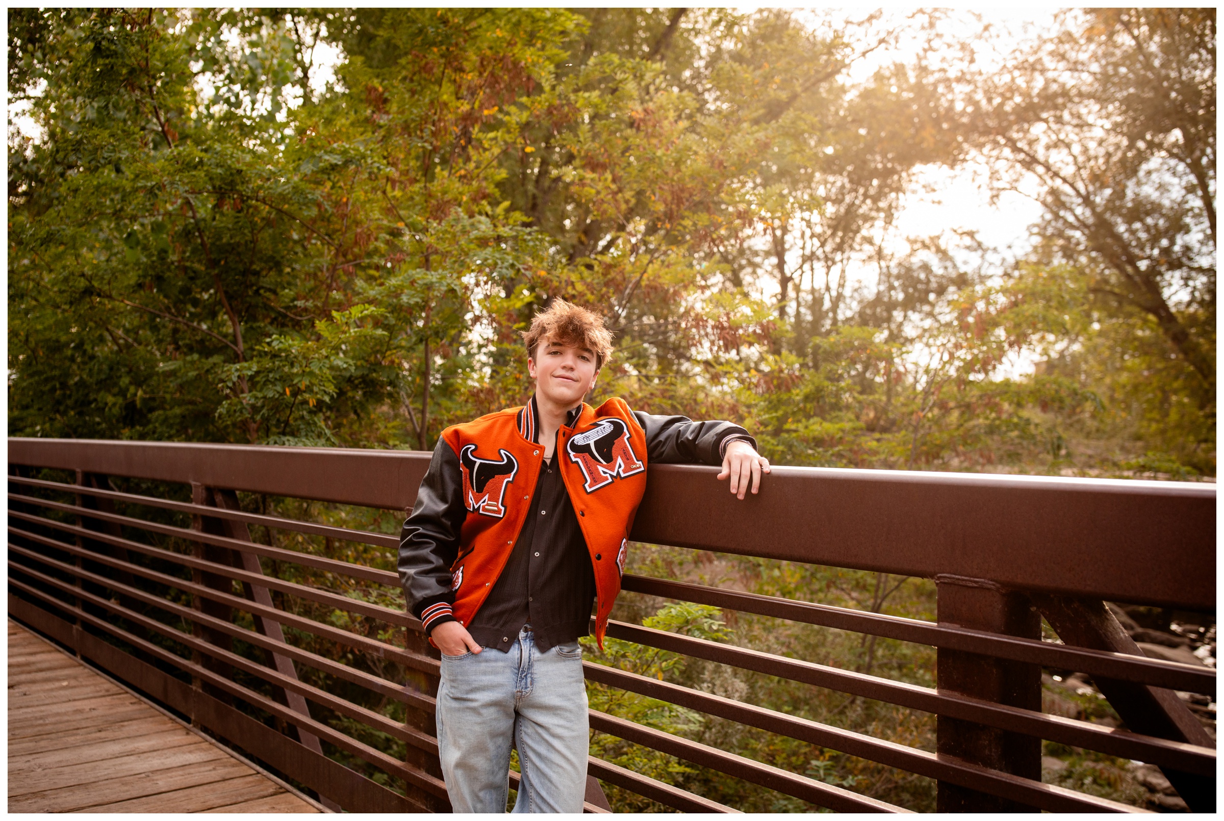 teen leaning against bridge at Golden Ponds during Mead High senior pictures at Golden Ponds Colorado